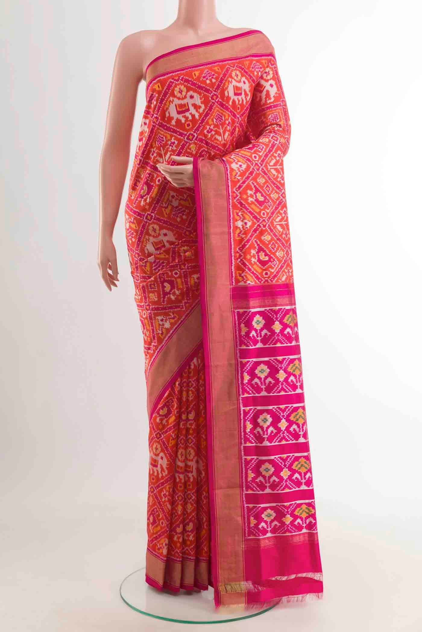 Orange Pochampally Silk Saree with Pure Ikat on the body and Zari Border displayed on a mannequin