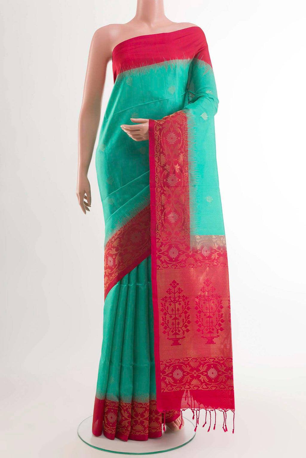 Sea Green Soft Silk Saree with Zari Butta on the body and Zari Border displayed on a mannequin