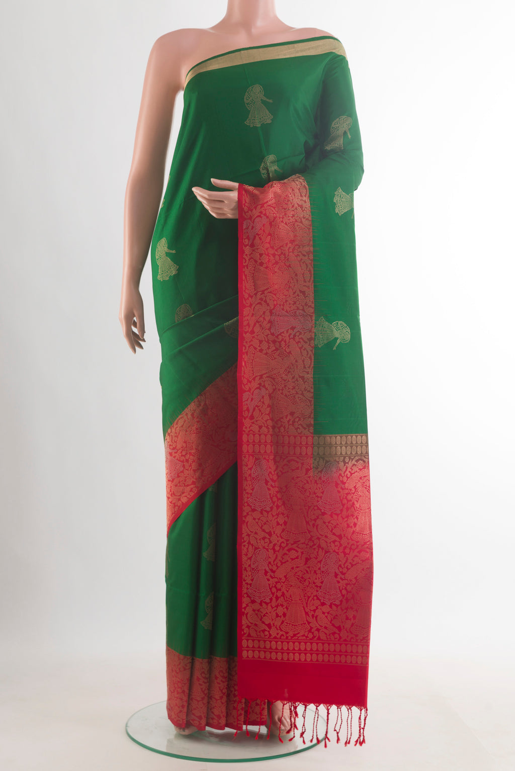 Pure Silk Green Soft Saree with Zari Butta on the body and Zari Border.  displayed on a mannequin
