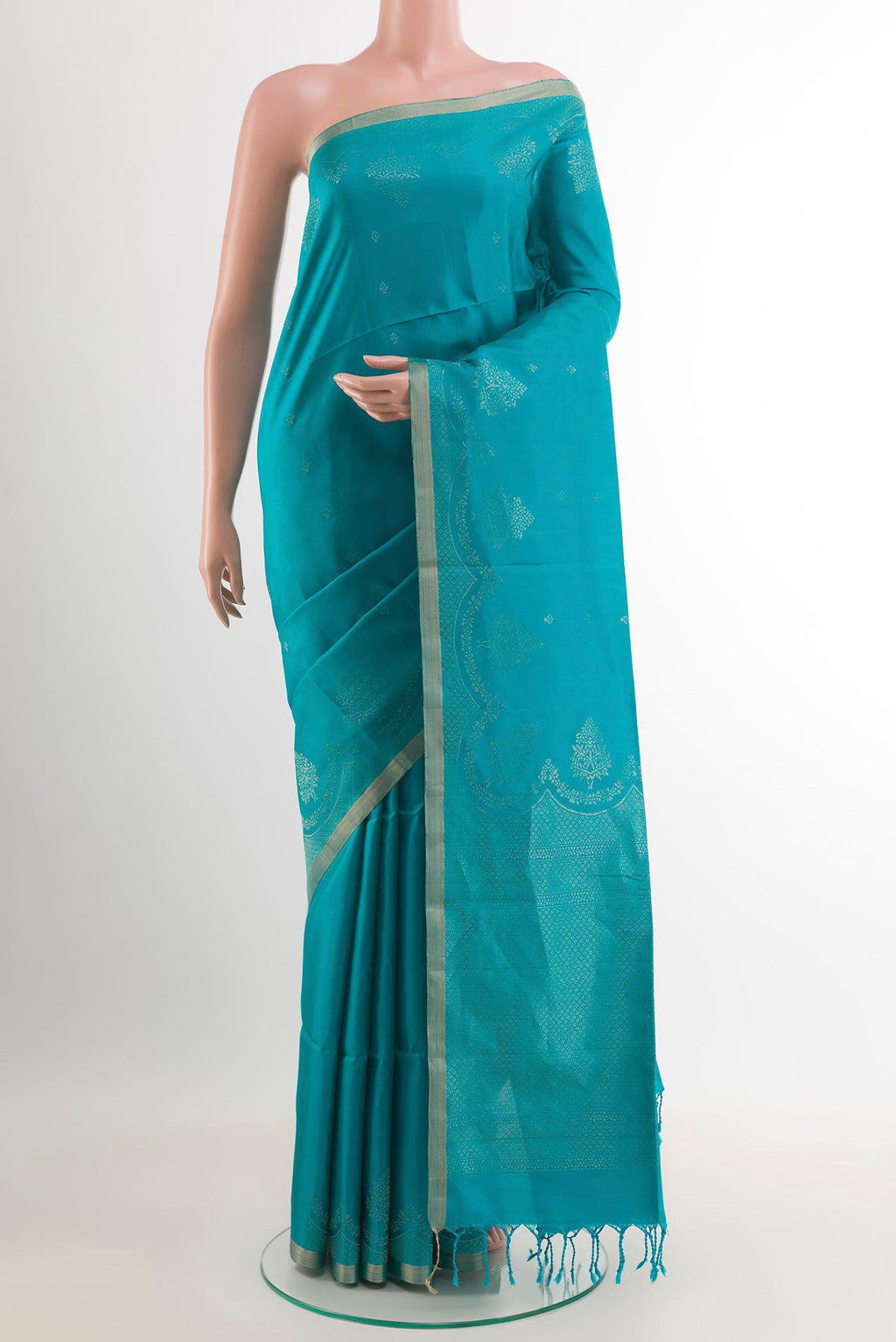 Blue Soft Silk Saree with Zari Butta on the body and Zari Border.  displayed on a mannequin