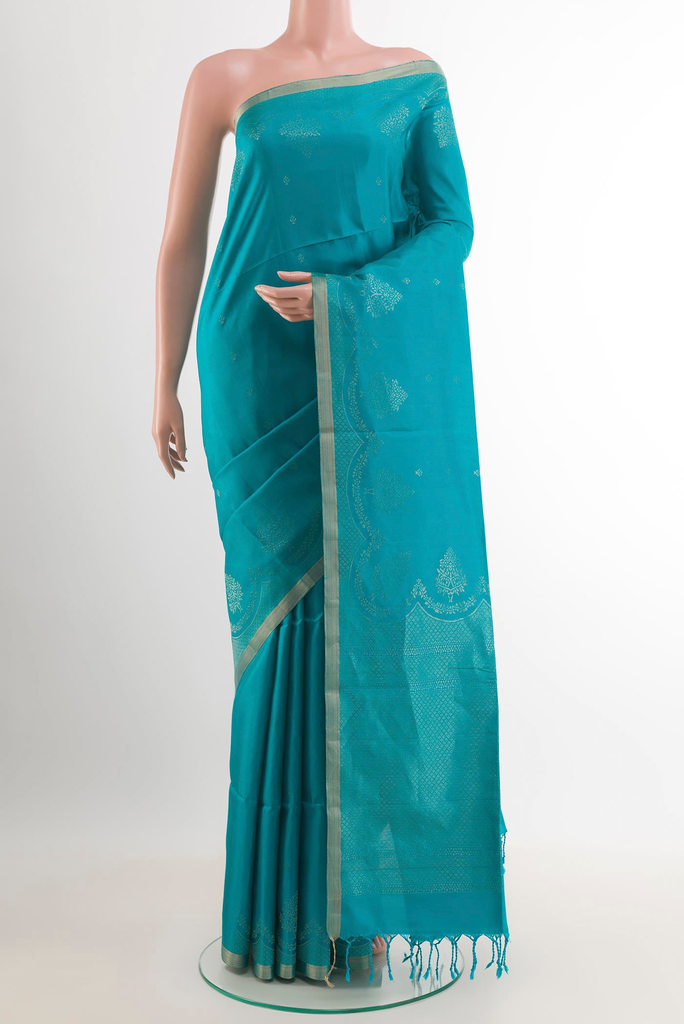 Blue Soft Silk Saree with Zari Butta on the body and Zari Border.  displayed on a mannequin