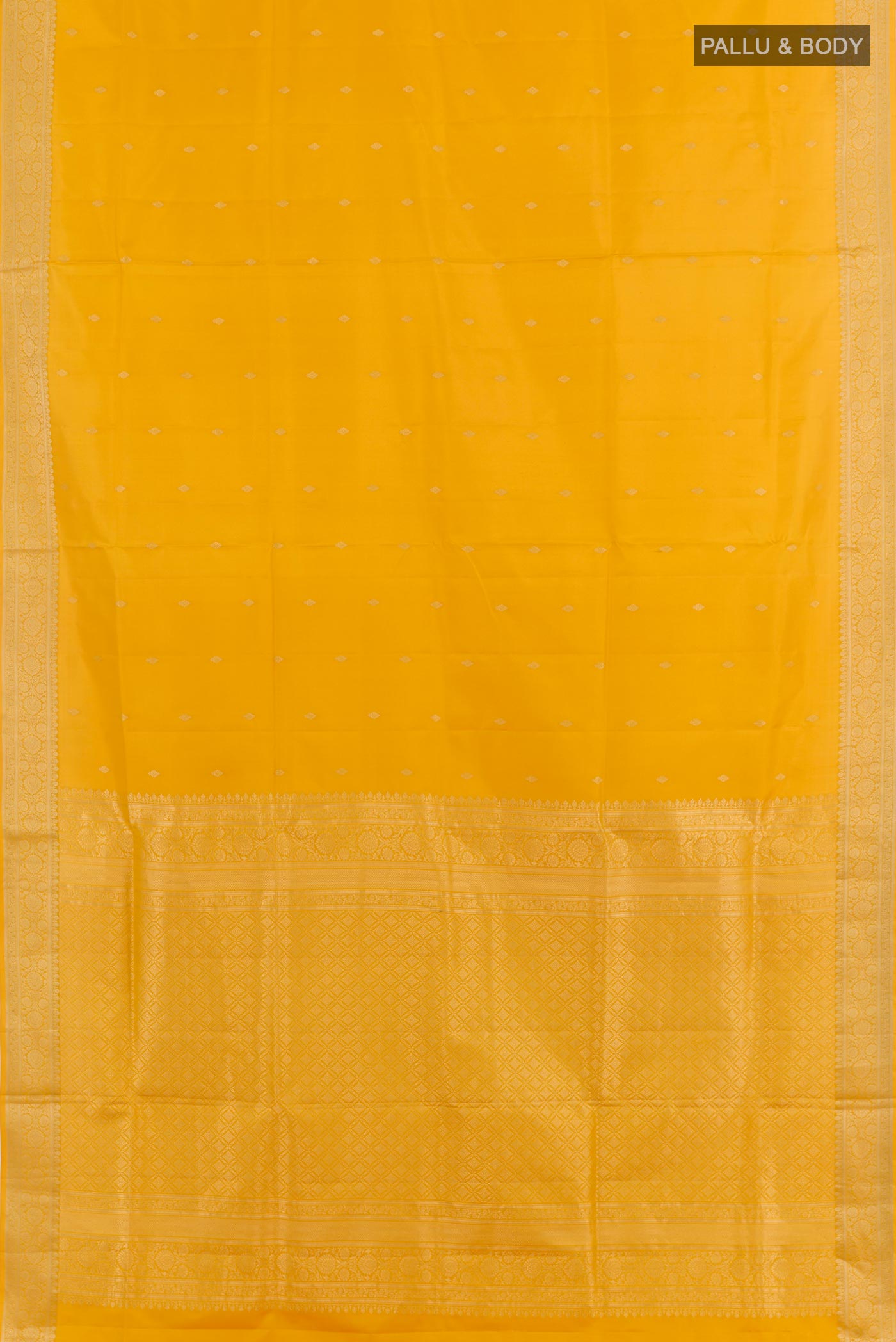Flat view of Yellow Soft Silk Saree with Zari Butta on the body and Zari Border. 