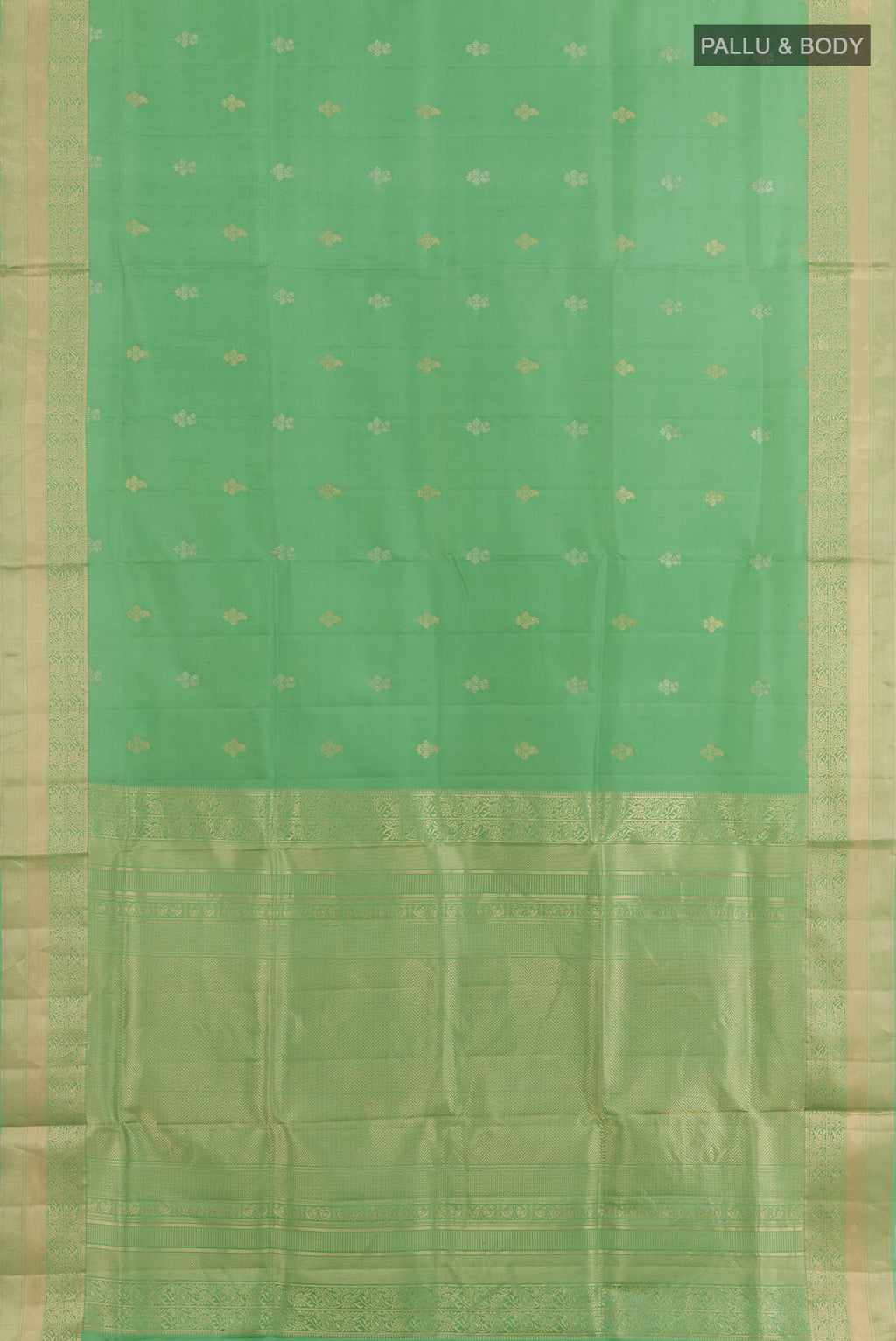 Flat view of Light Green Soft Silk Saree with Zari Butta on the body and Zari Border. 