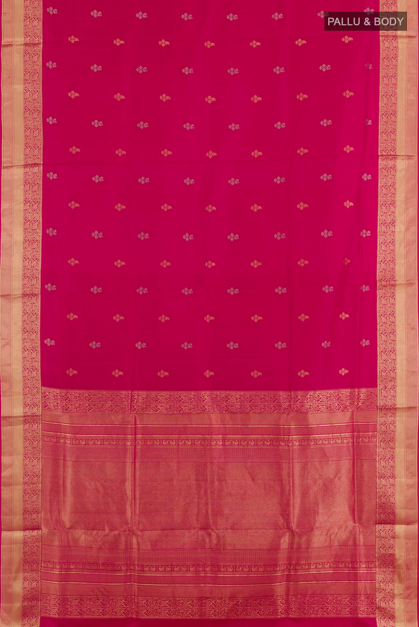 Flat view of Rani Pink Soft Silk Saree with Zari Butta on the body and Zari Border. 