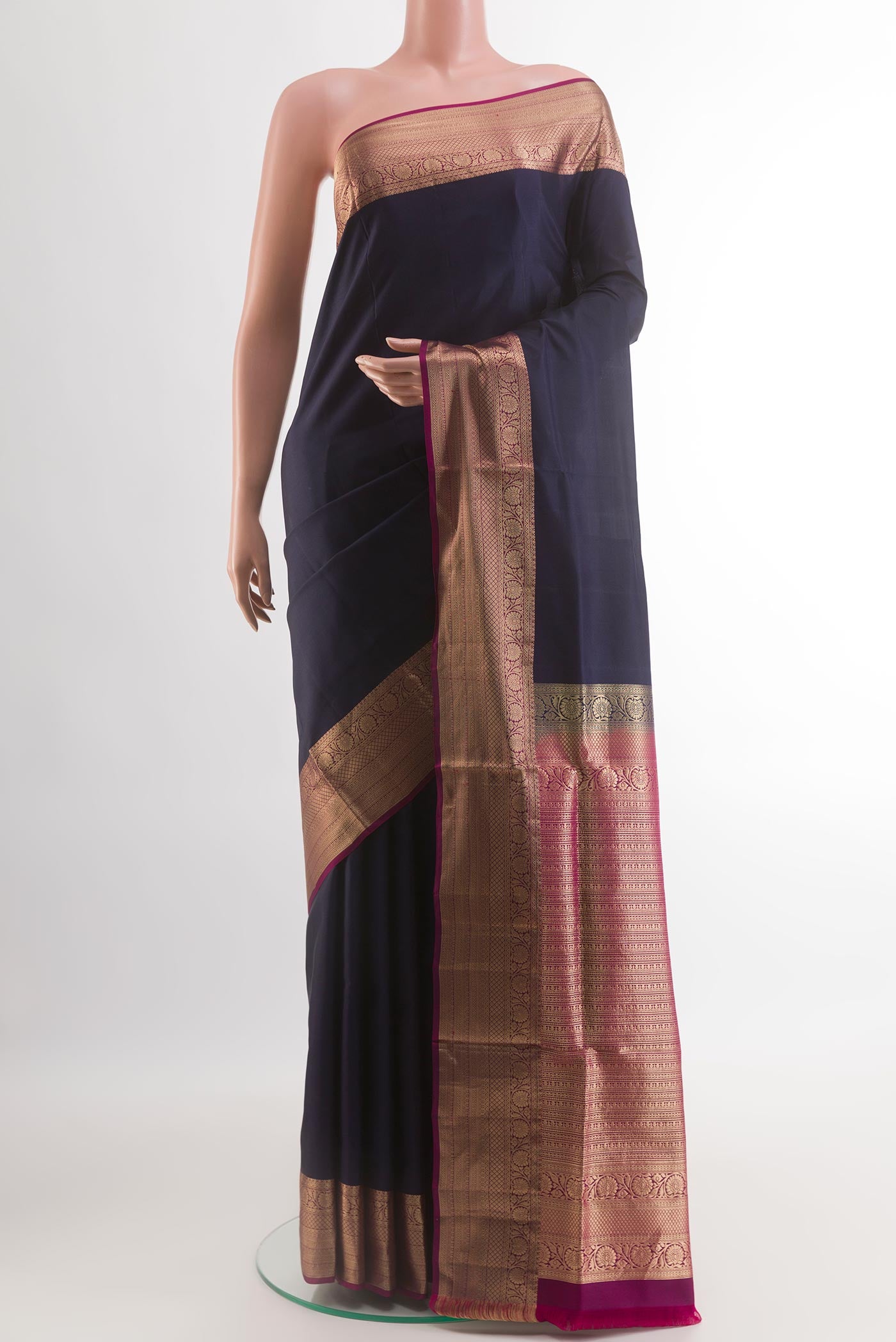 Navy Blue Soft Silk Saree with Plain Body and Zari Border.  displayed on a mannequin