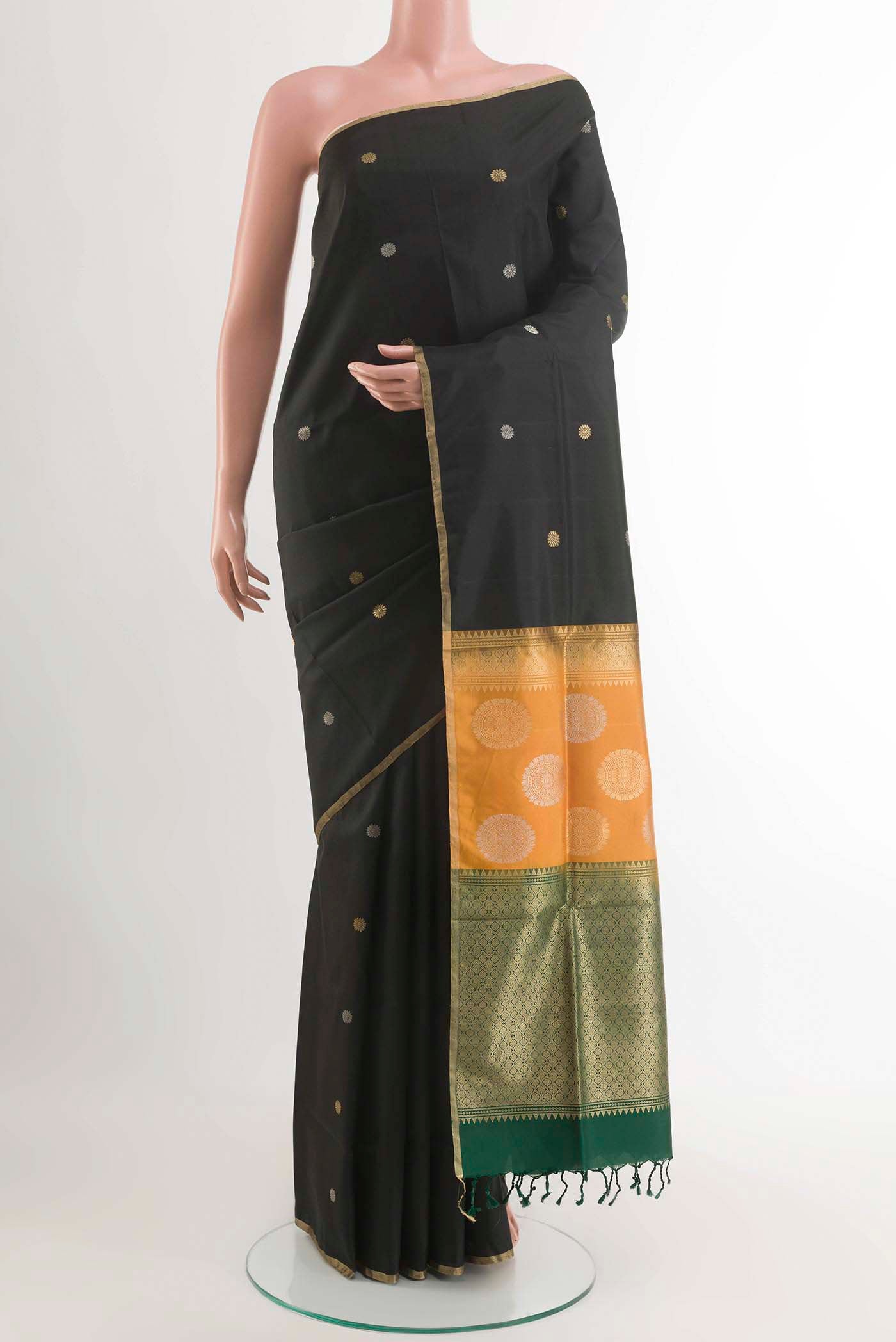 Black Soft Silk Saree with Zari Butta on the body and Zari Border displayed on a mannequin
