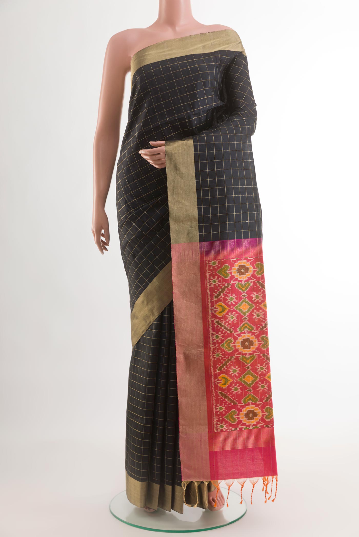 Black Soft Silk Saree with Checked design on the body and Zari Border.  displayed on a mannequin