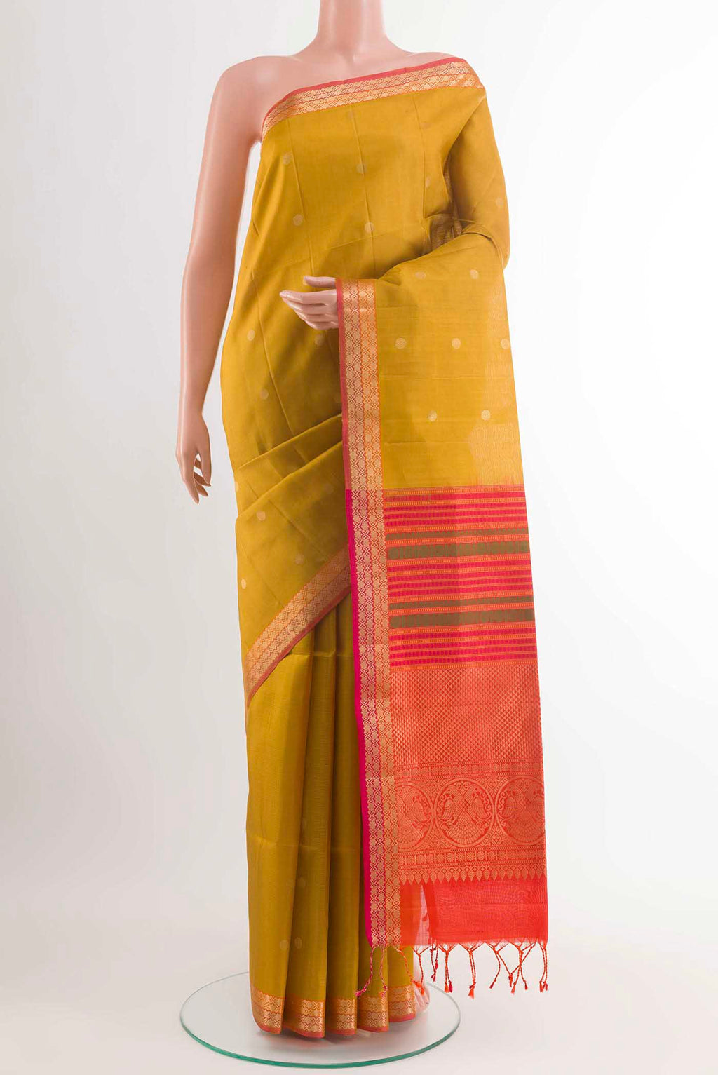 Yellow Soft Silk Saree with Zari Butta on the body and Zari Border displayed on a mannequin