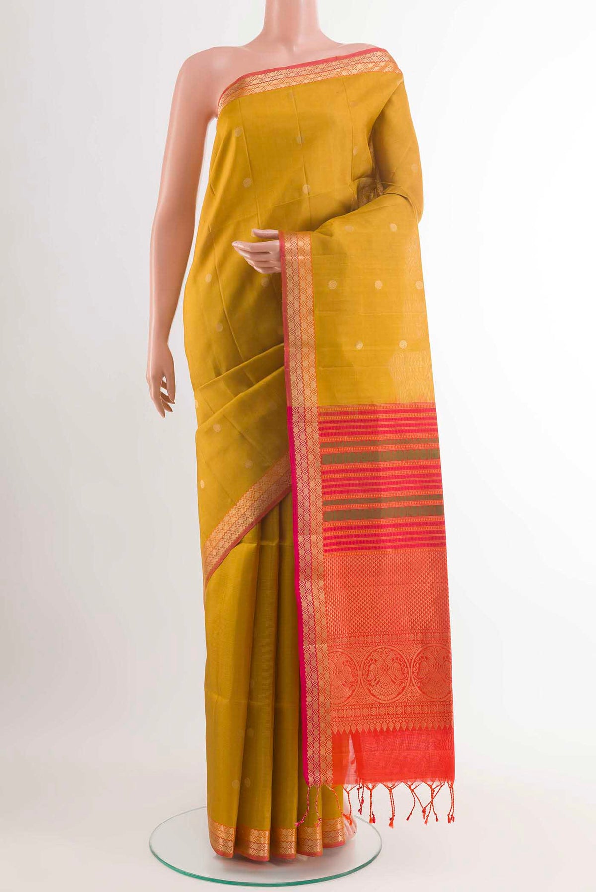 Yellow Soft Silk Saree with Zari Butta on the body and Zari Border displayed on a mannequin