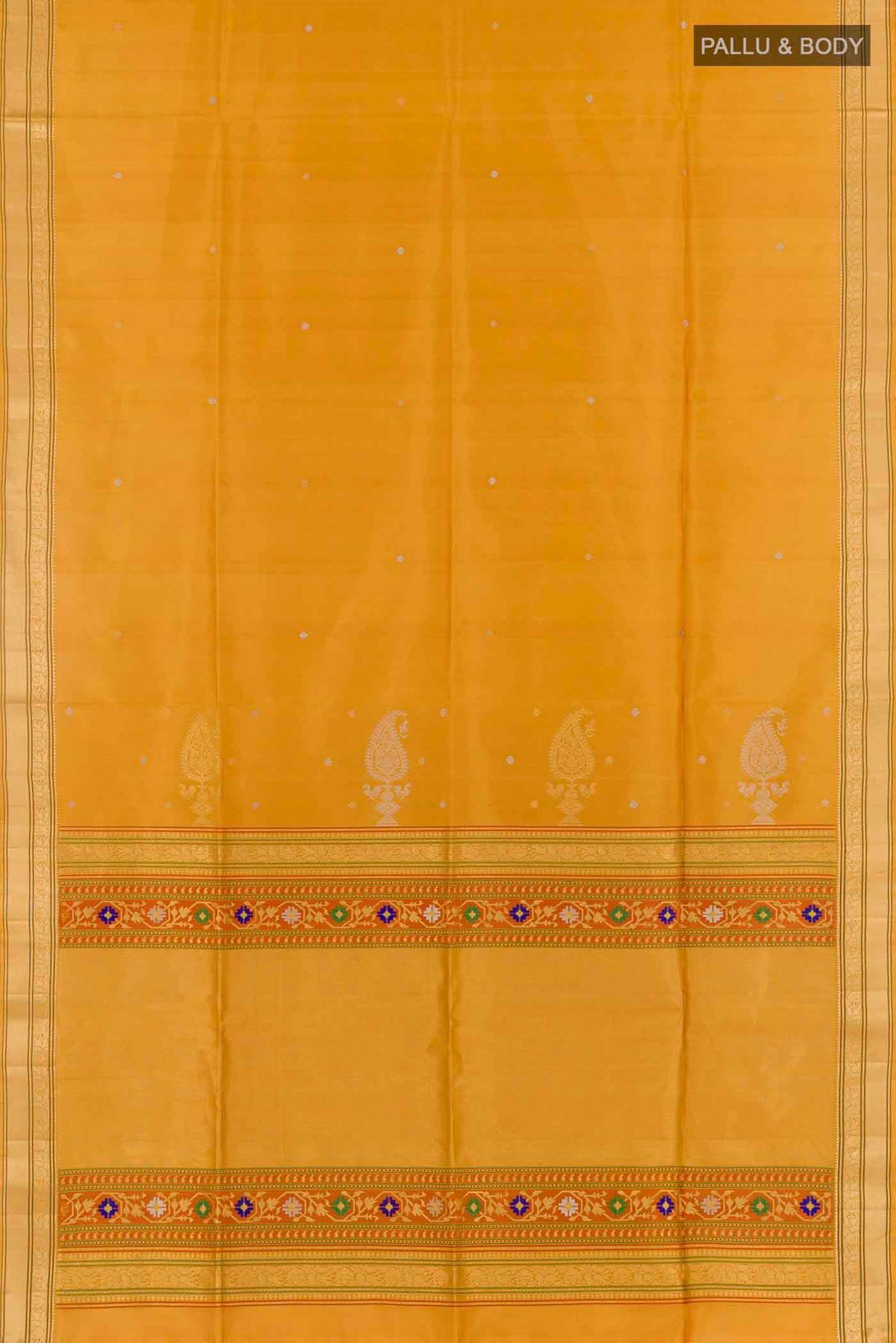 Flat view of Mustard Soft Silk Saree with Zari Butta on the body and Zari Border