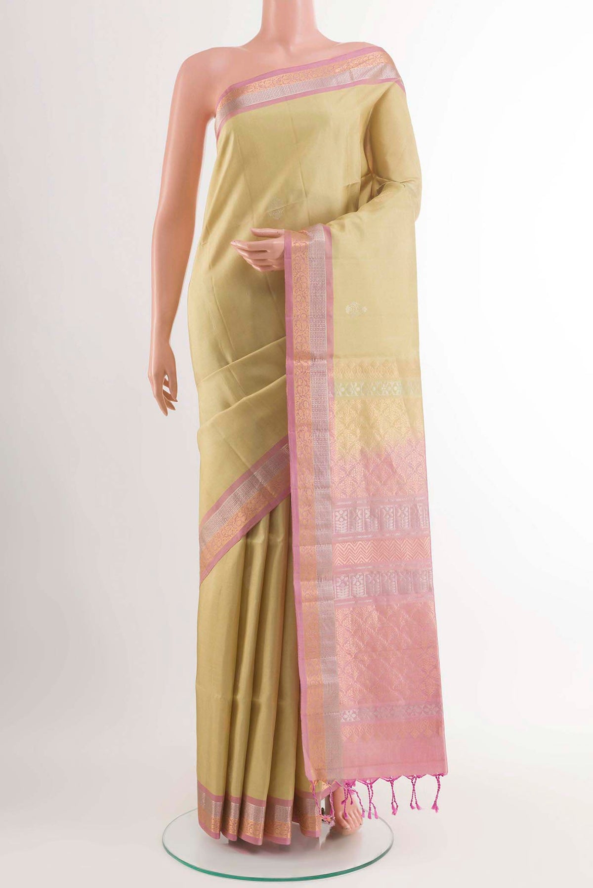 Mint Green Soft Silk Saree with Zari Butta on the body and Zari Border displayed on a mannequin