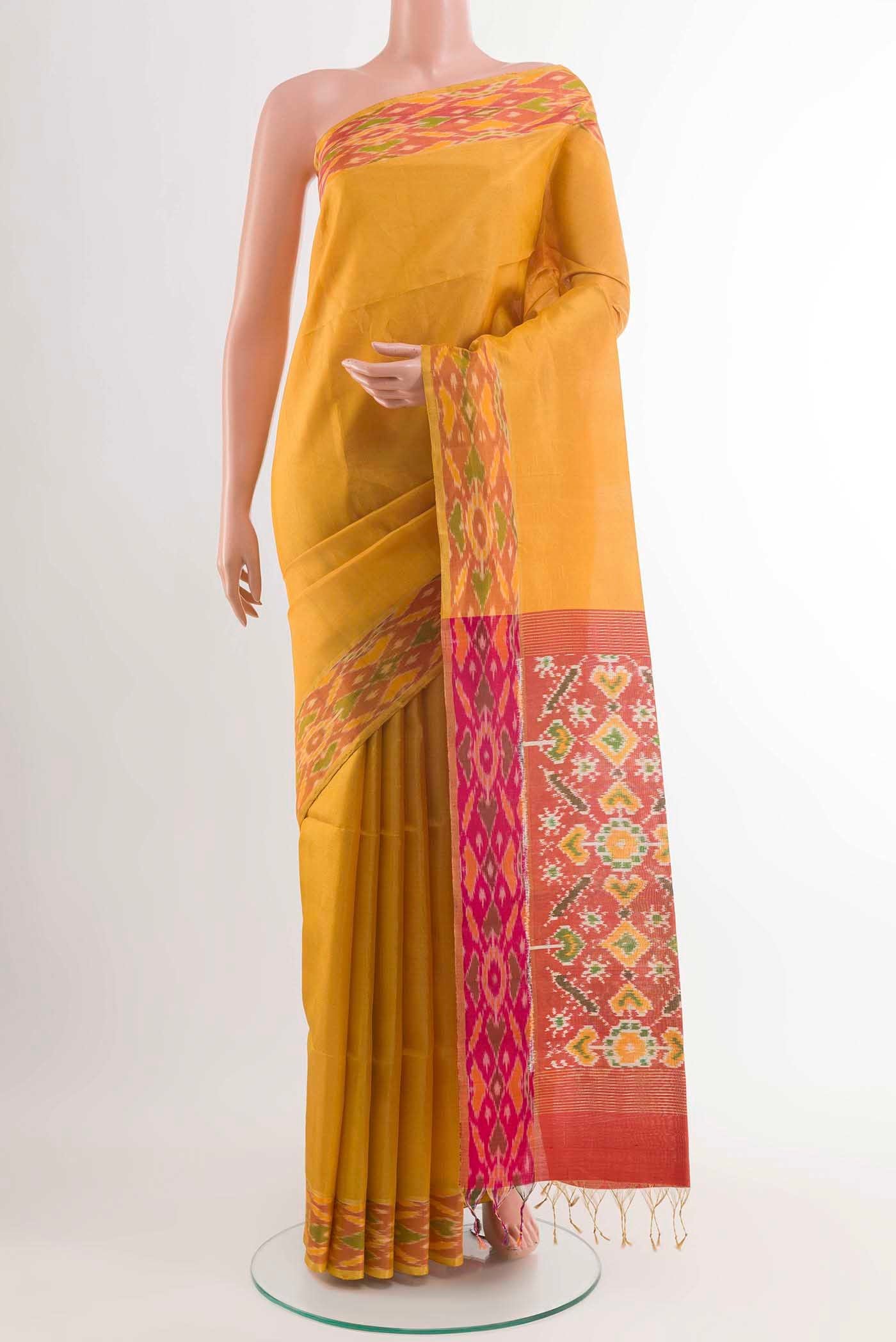 Yellow Soft Silk Saree with Plain Body and Zari Border displayed on a mannequin