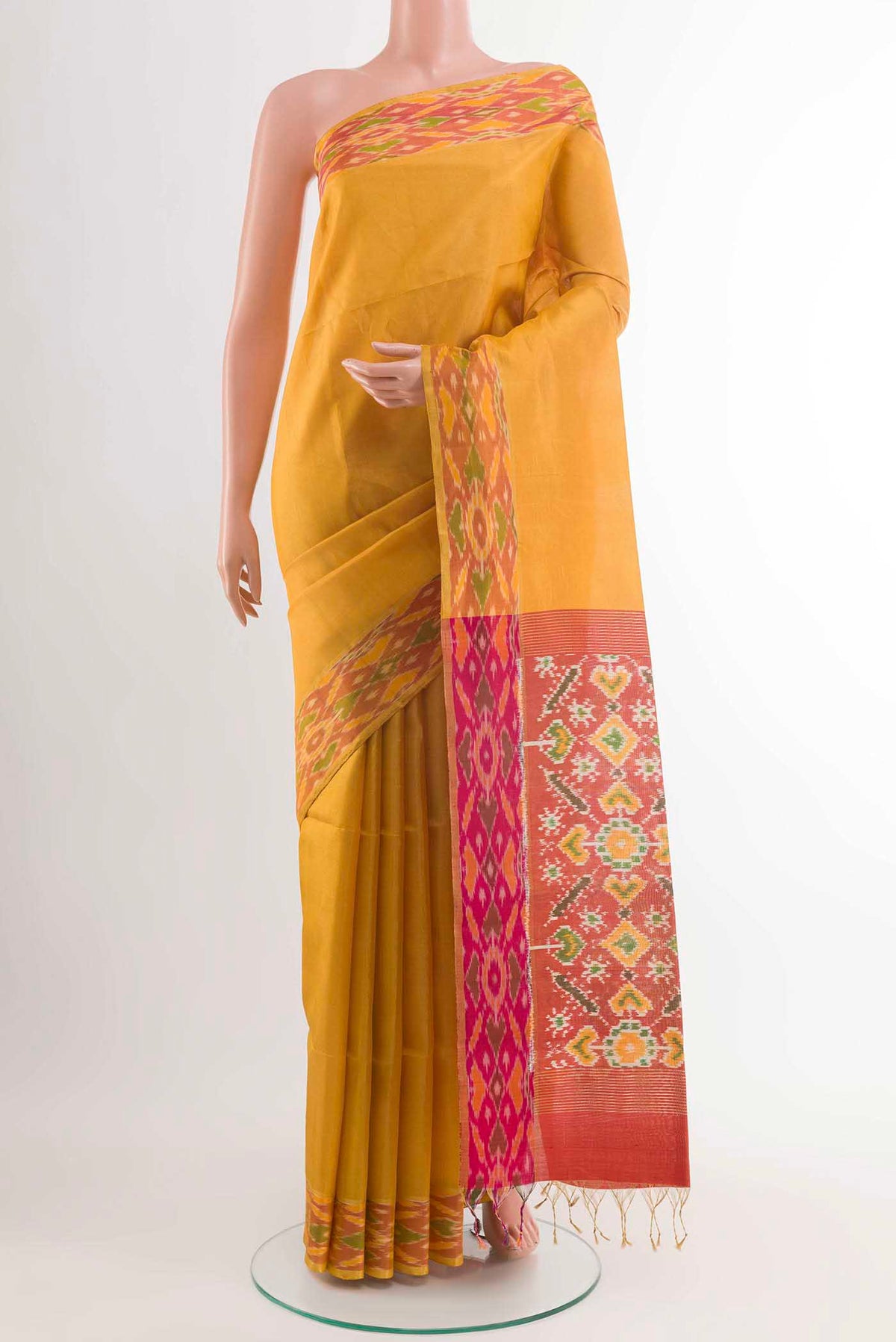 Yellow Soft Silk Saree with Plain Body and Zari Border displayed on a mannequin