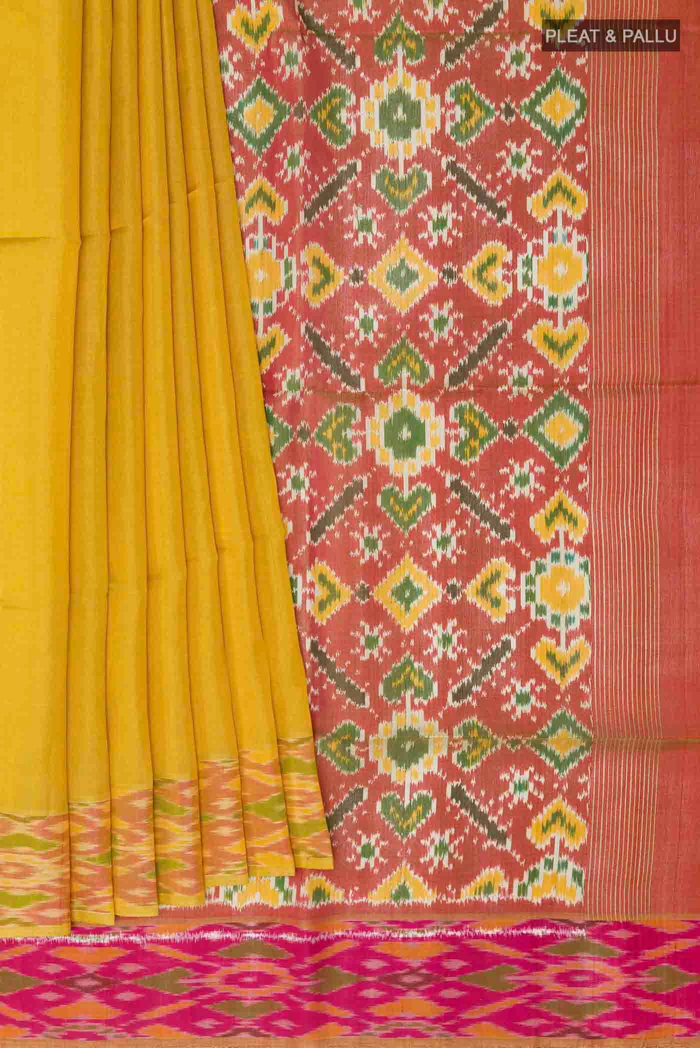 Pleats and pallu of Yellow Soft Silk Saree with Plain Body and Zari Border