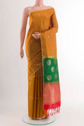 Yellow Soft Silk Saree with Zari Butta on the body and Zari Border displayed on a mannequin