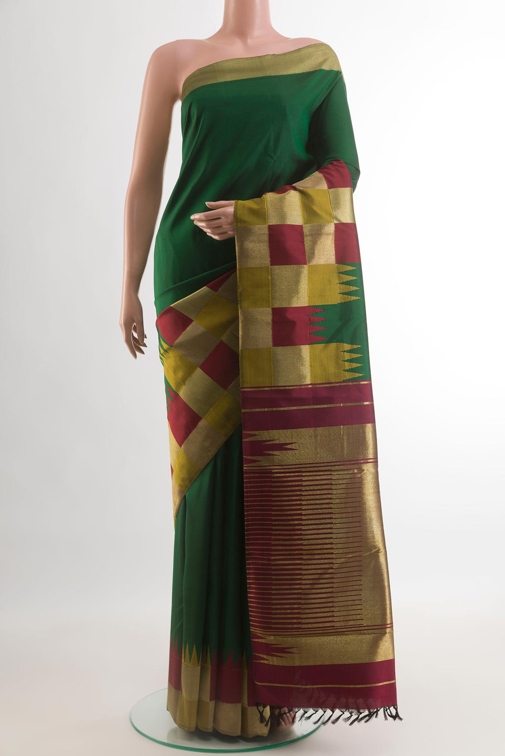 Green Kanjivaram Silk Saree with Plain Body and Zari Border.  displayed on a mannequin