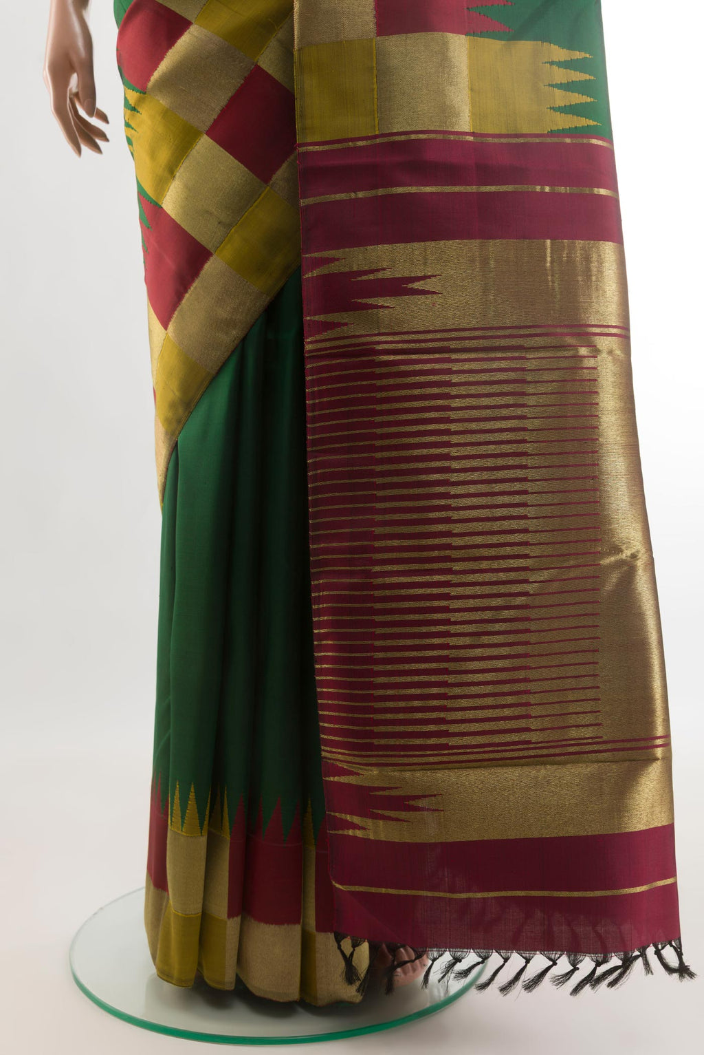 Pleats and pallu of Green Kanjivaram Silk Saree with Plain Body and Zari Border. 