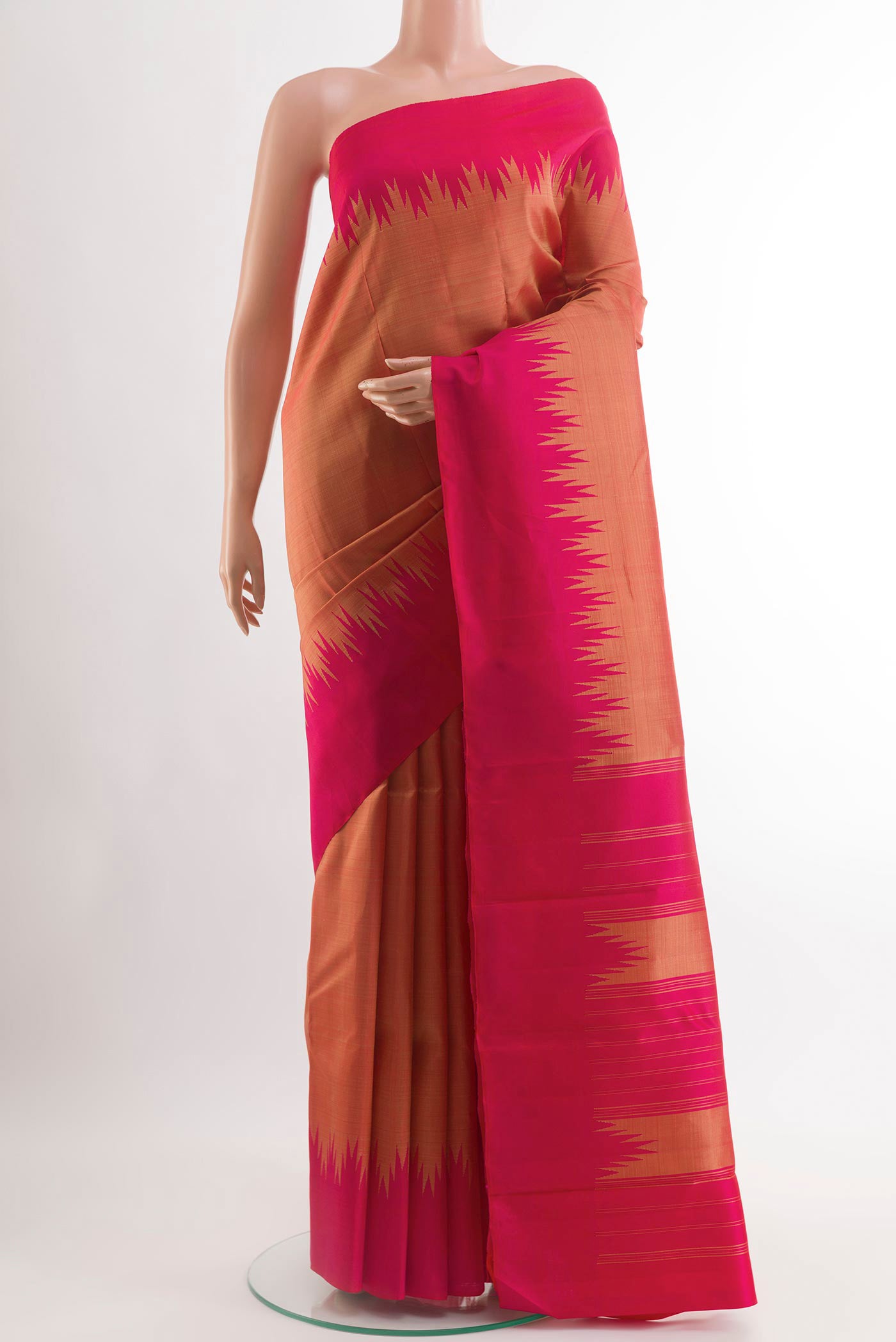 Orange Kanchipuram Silk Saree with Plain Body and Zari Border.  displayed on a mannequin