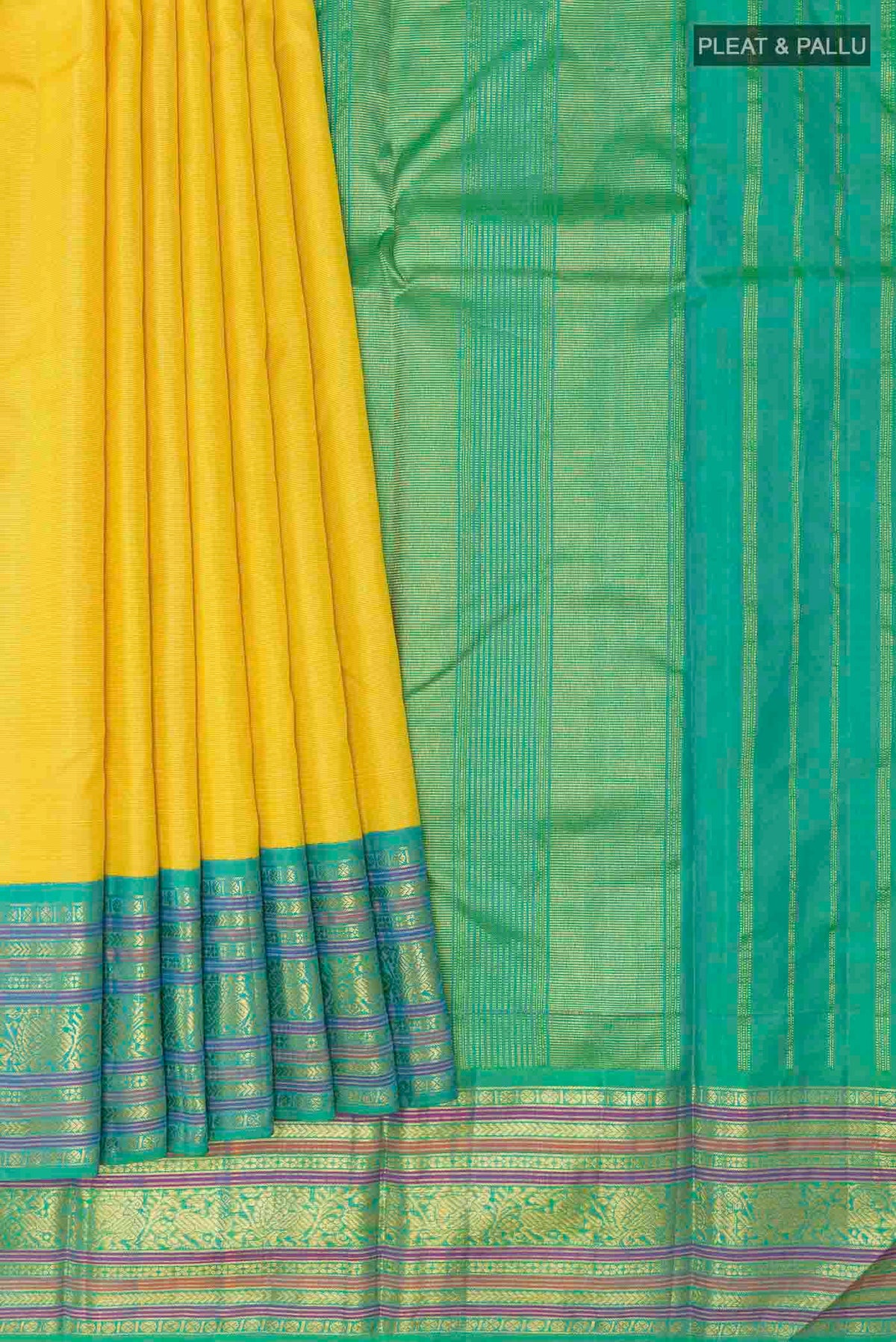 Pleats and pallu of Yellow Kanchipuram Silk Saree with Zari Butta on the body and Ganga Jamuna Border