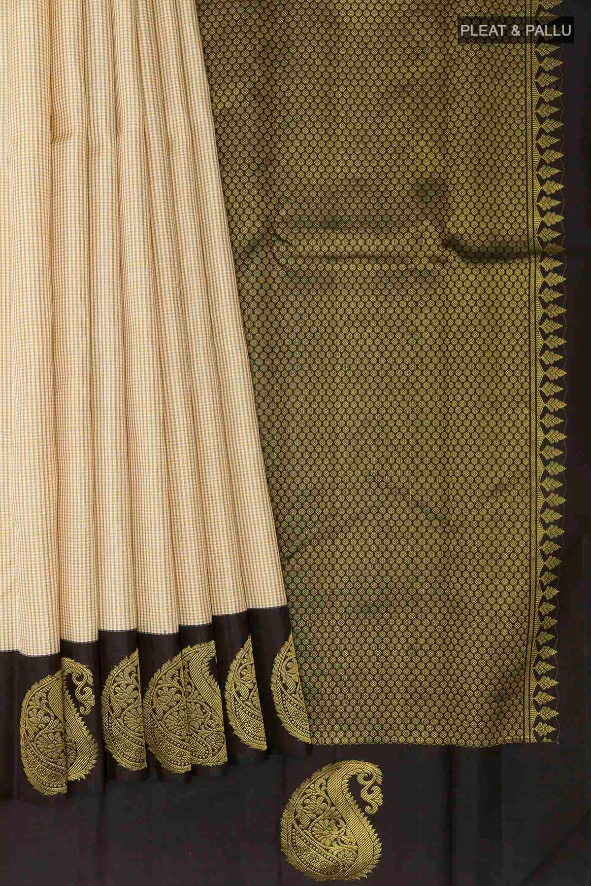 Pleats and pallu of Off White Kanchipuram Silk Saree with Checked design on the body and Zari Border