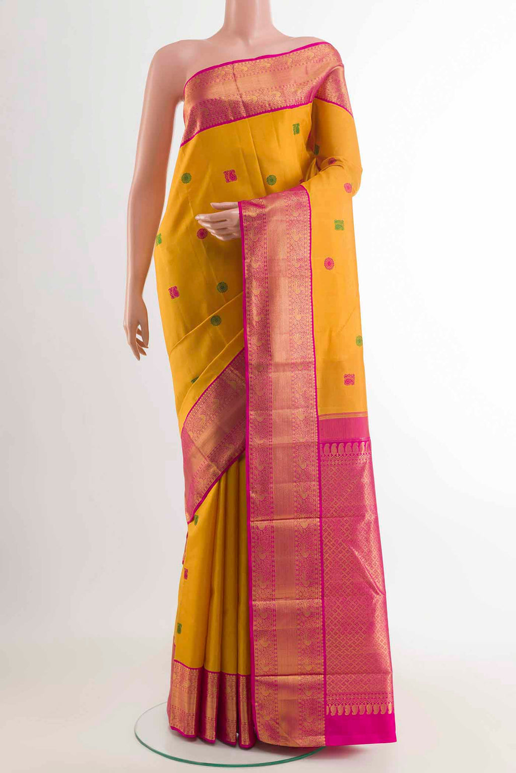 Yellow Kanchipuram Silk Saree with Thread Butta on the body and Zari Border displayed on a mannequin