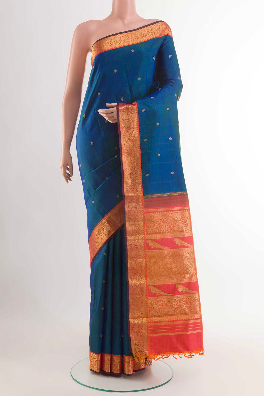 Peacock Blue Kanchipuram Silk Saree with Zari Butta on the body and Zari Border displayed on a mannequin