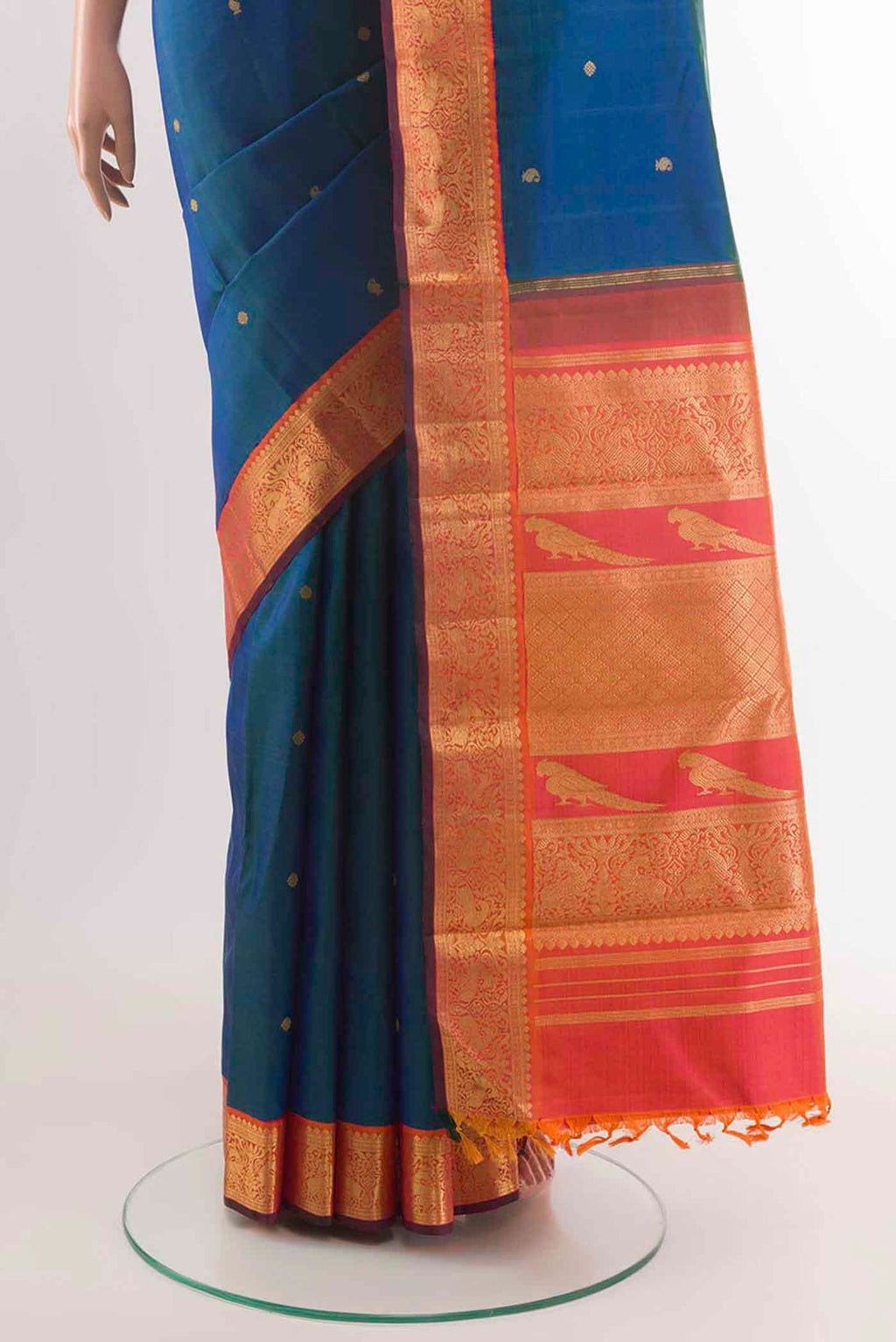 Pleats and pallu of Peacock Blue Kanchipuram Silk Saree with Zari Butta on the body and Zari Border