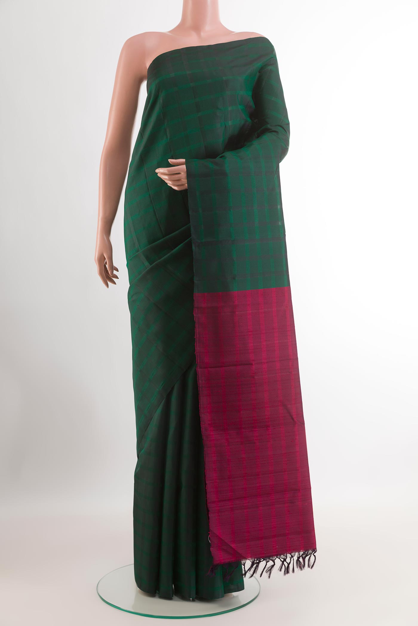 Bottle Green Kanchipuram Silk Saree with Checked design on the body and Without Border.  displayed on a mannequin