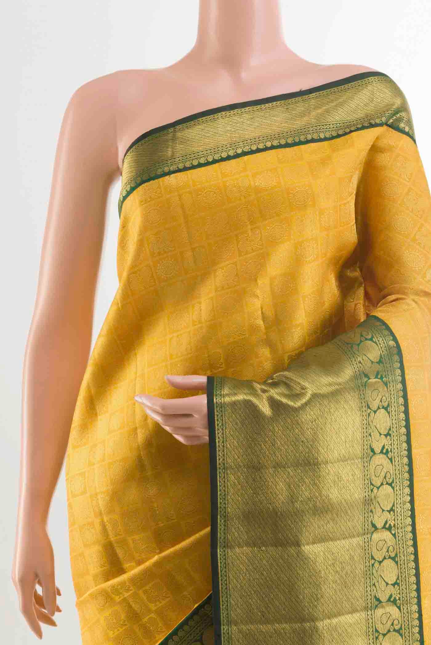 Border image of Pure Silk Pure Zari Yellow Kanchipuram Saree with Zari Brocade on the body and Zari Border