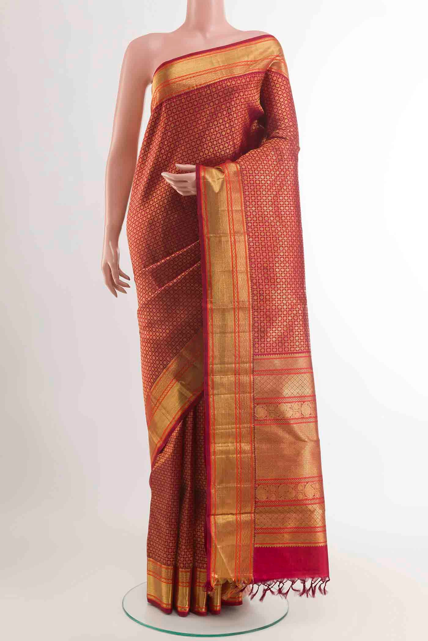 Maroon Kanchipuram Silk Saree with Zari Brocade on the body and Zari Border displayed on a mannequin