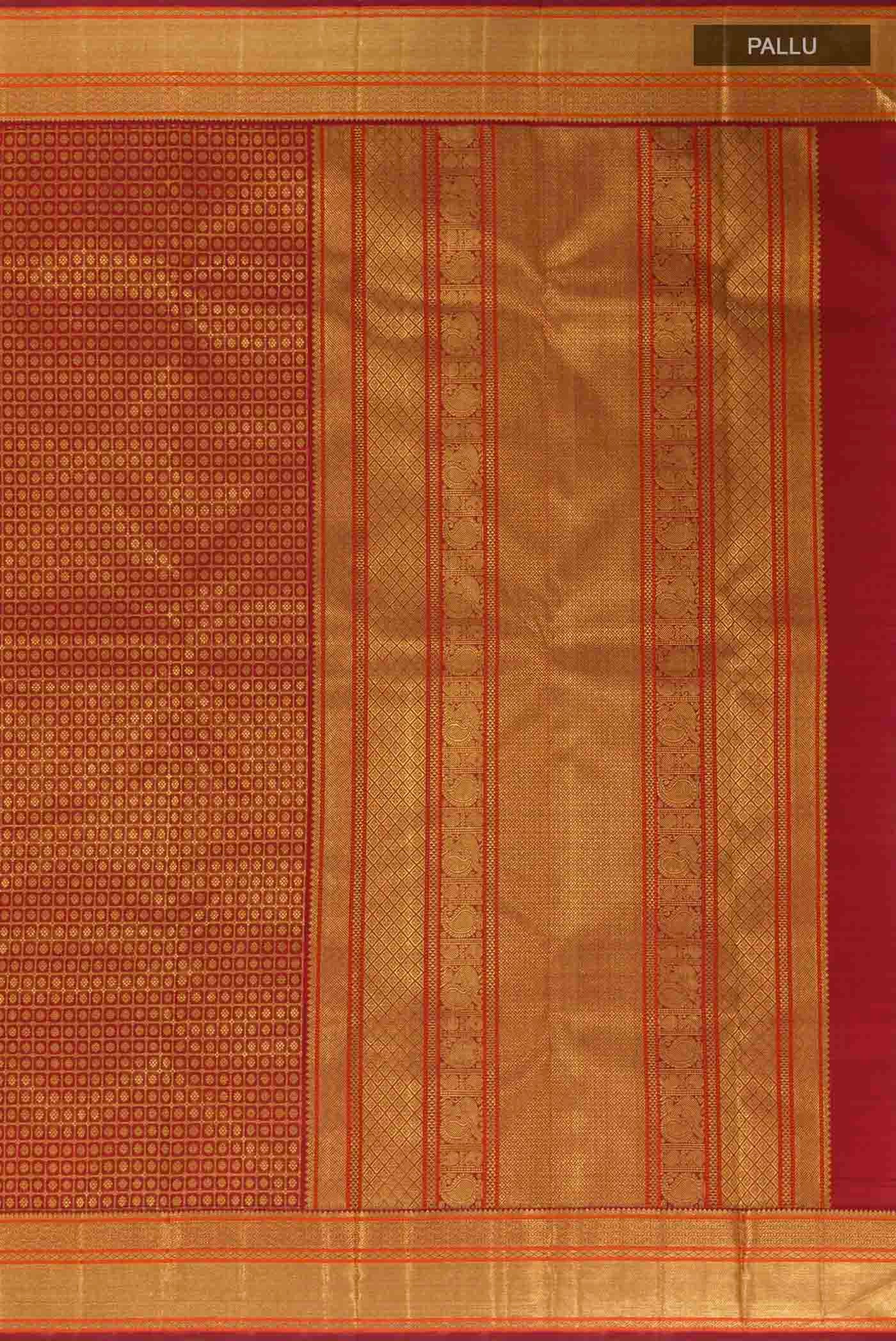 Close up image of the pallu of Maroon Kanchipuram Silk Saree with Zari Brocade on the body and Zari Border