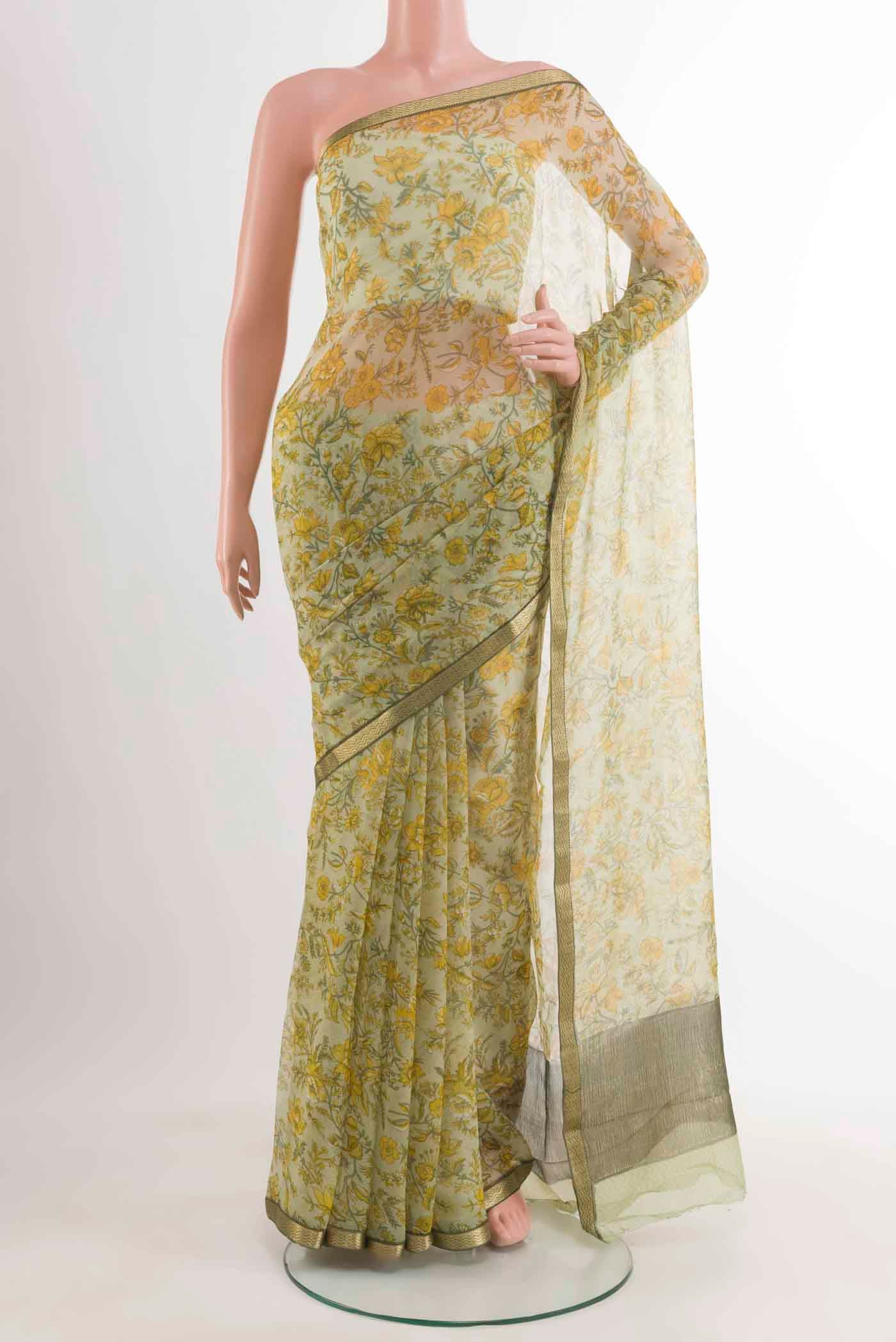 Cream Mysore Chiffon Saree with Floral Print on the body and Zari Border displayed on a mannequin