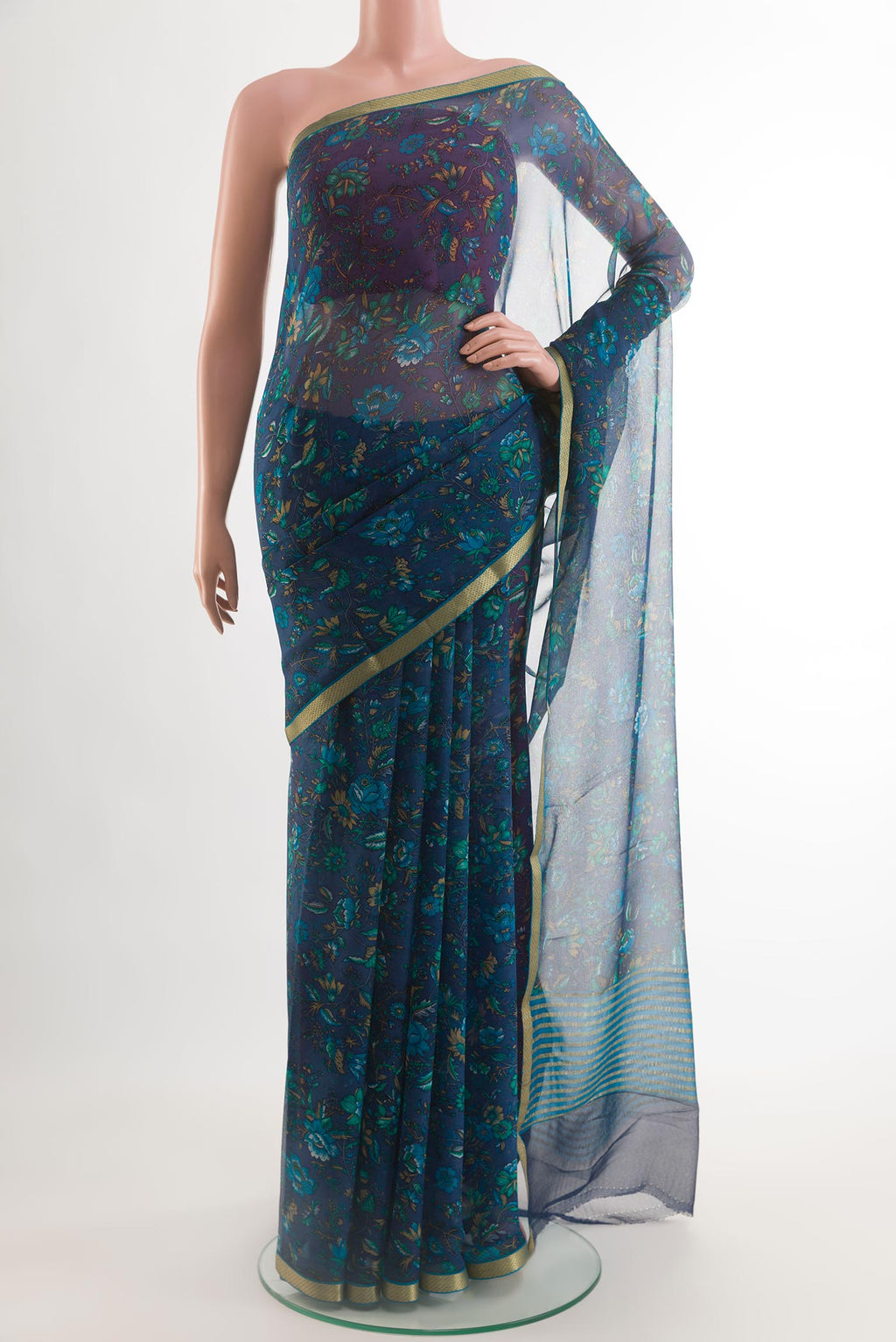 Dark Blue Chiffon Saree with Printed design on the body and Plain Border.  displayed on a mannequin