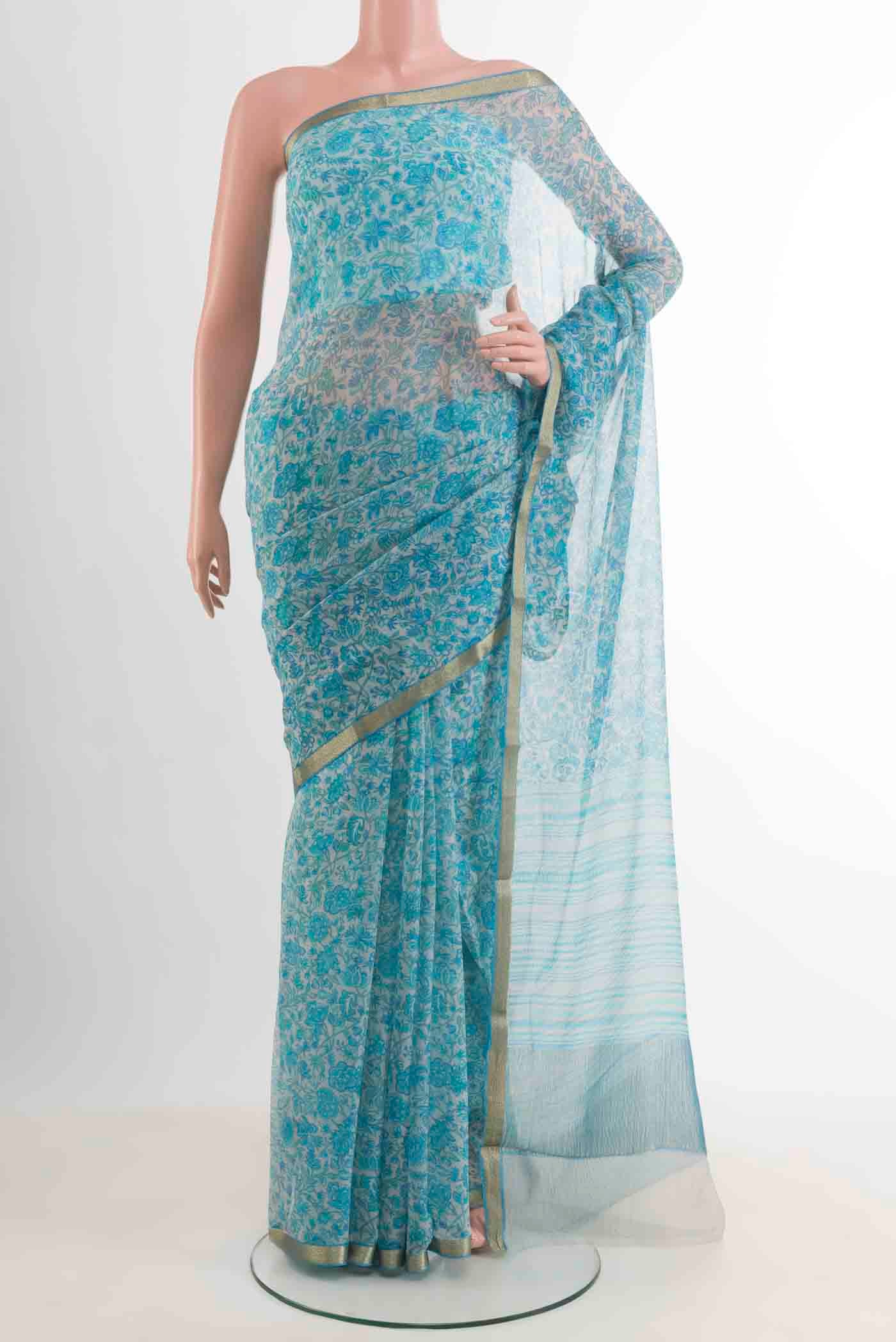 Blue Mysore Chiffon Saree with Printed design on the body and Zari Border displayed on a mannequin