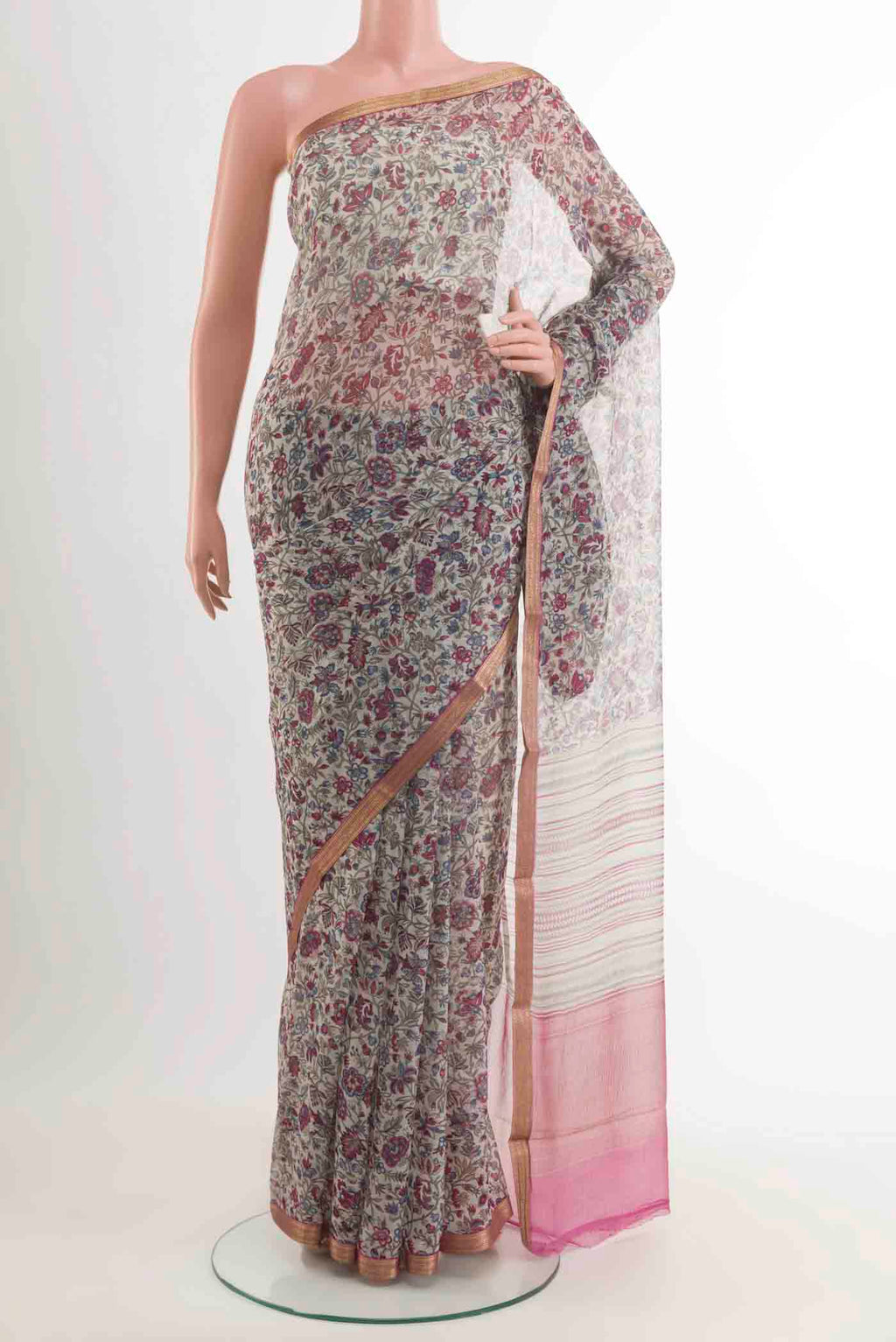 Off White Chiffon Saree with Printed design on the body and Zari Border displayed on a mannequin