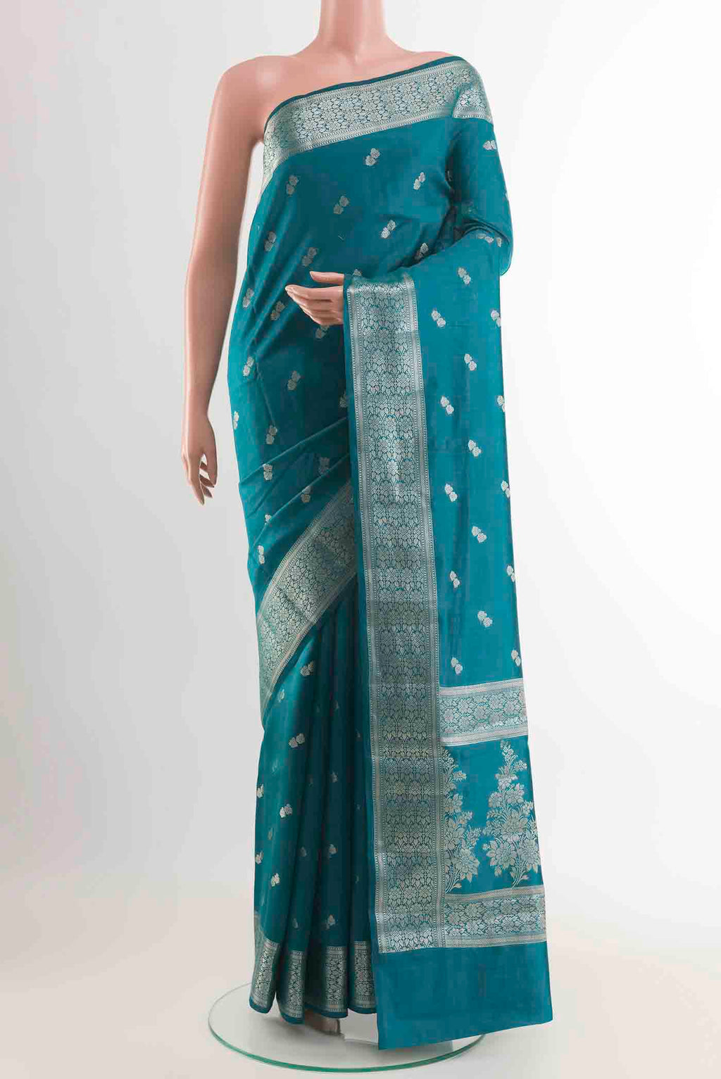 Blue Banarasi Raw Silk Saree with Zari Butta on the body and Zari Border displayed on a mannequin