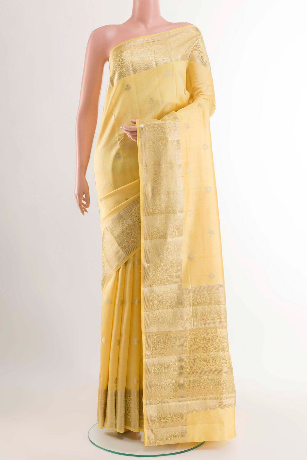 Lemon Yellow Banarasi Raw Silk Saree with Zari Butta on the body and Zari Border displayed on a mannequin