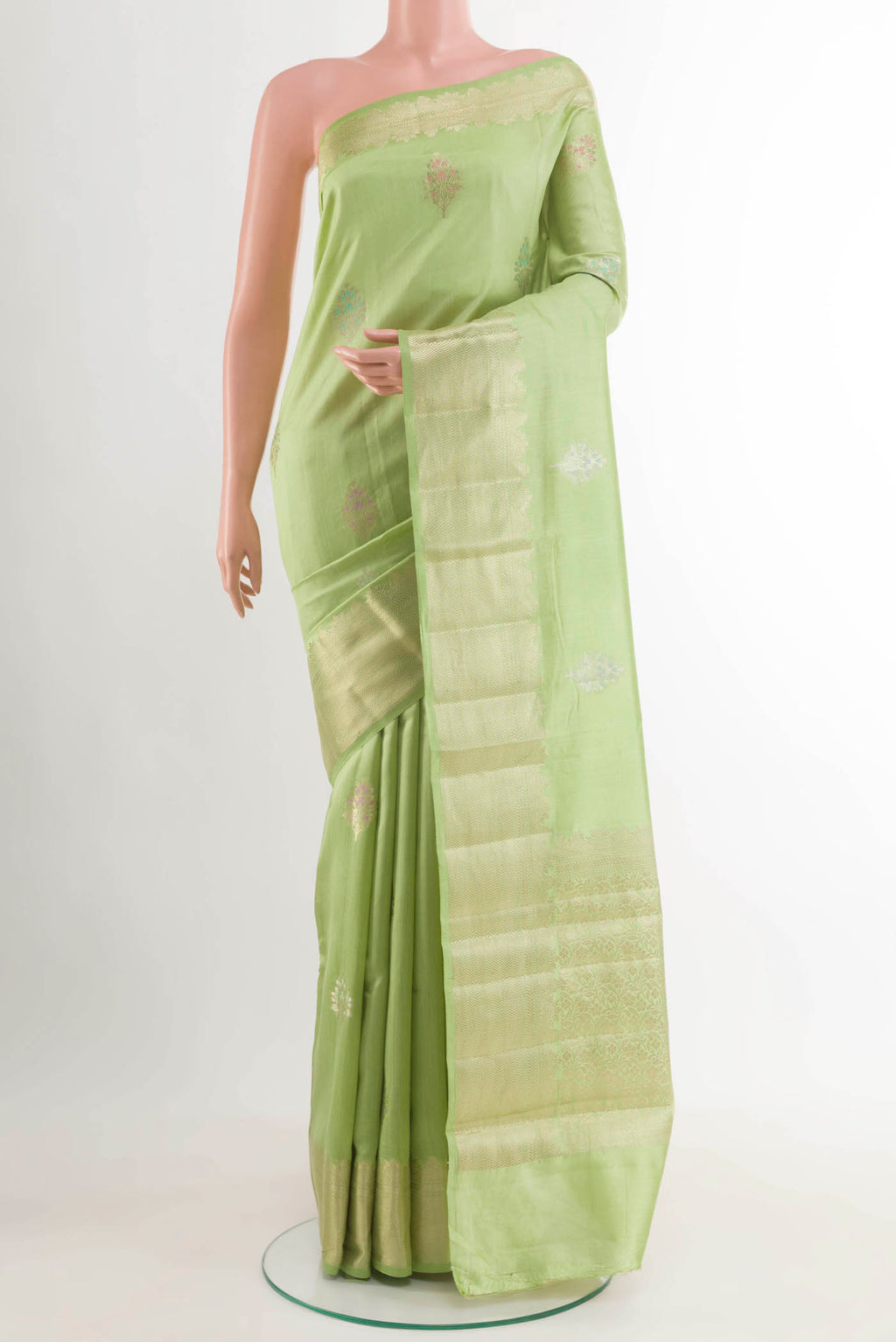 Pista Green Banarasi Raw Silk Saree with Zari Butta on the body and Zari Border displayed on a mannequin