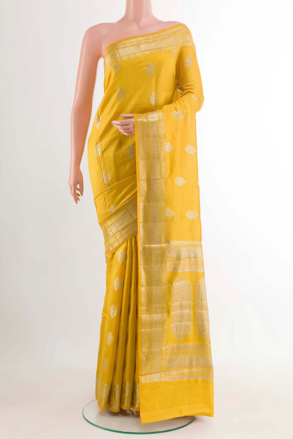 Yellow Banarasi Raw Silk Saree with Zari Butta on the body and Zari Border displayed on a mannequin