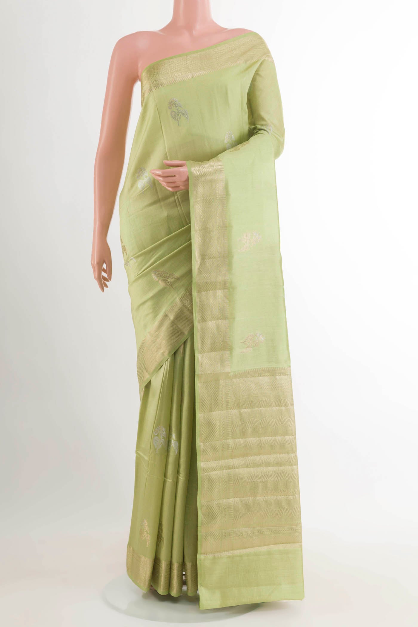 Light Green Banarasi Raw Silk Saree with Zari Butta on the body and Zari Border displayed on a mannequin