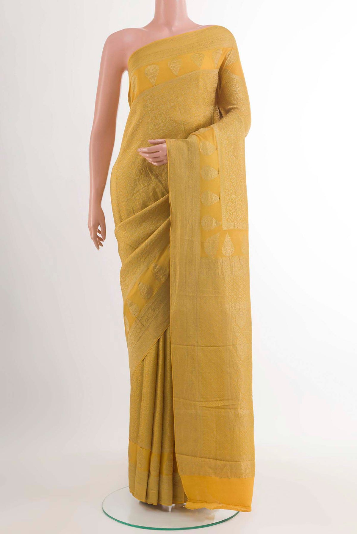 Yellow Mysore Crepe Saree with Zari Brocade on the body and Zari Border displayed on a mannequin