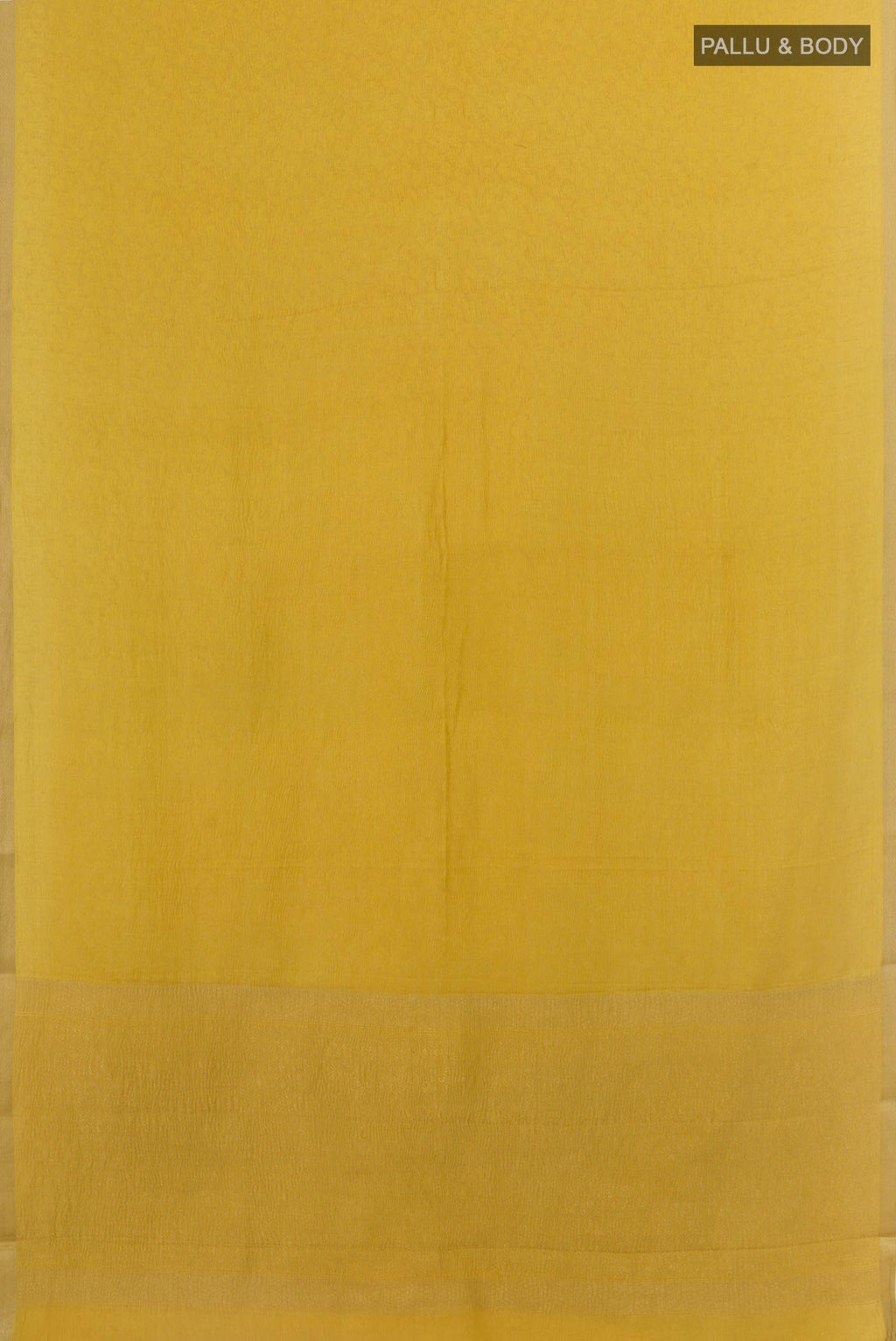 Flat view of Mustard Mysore Crepe Saree with Zari Brocade on the body and Zari Border. 