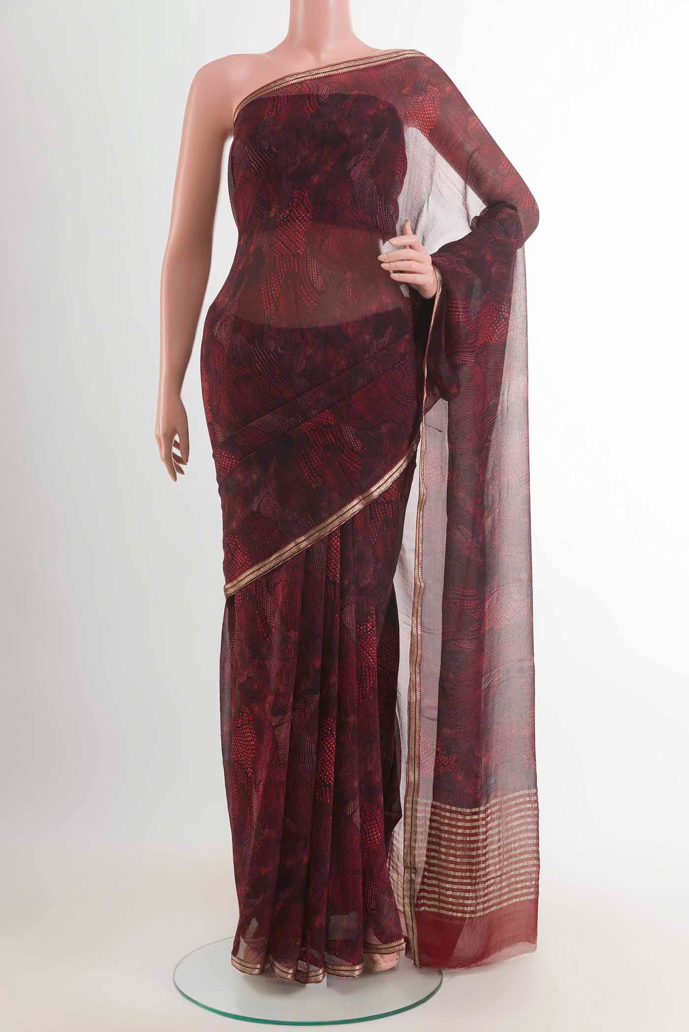 Coffee Brown Mysore Chiffon Saree with Printed design on the body and Thin Zari Line displayed on a mannequin
