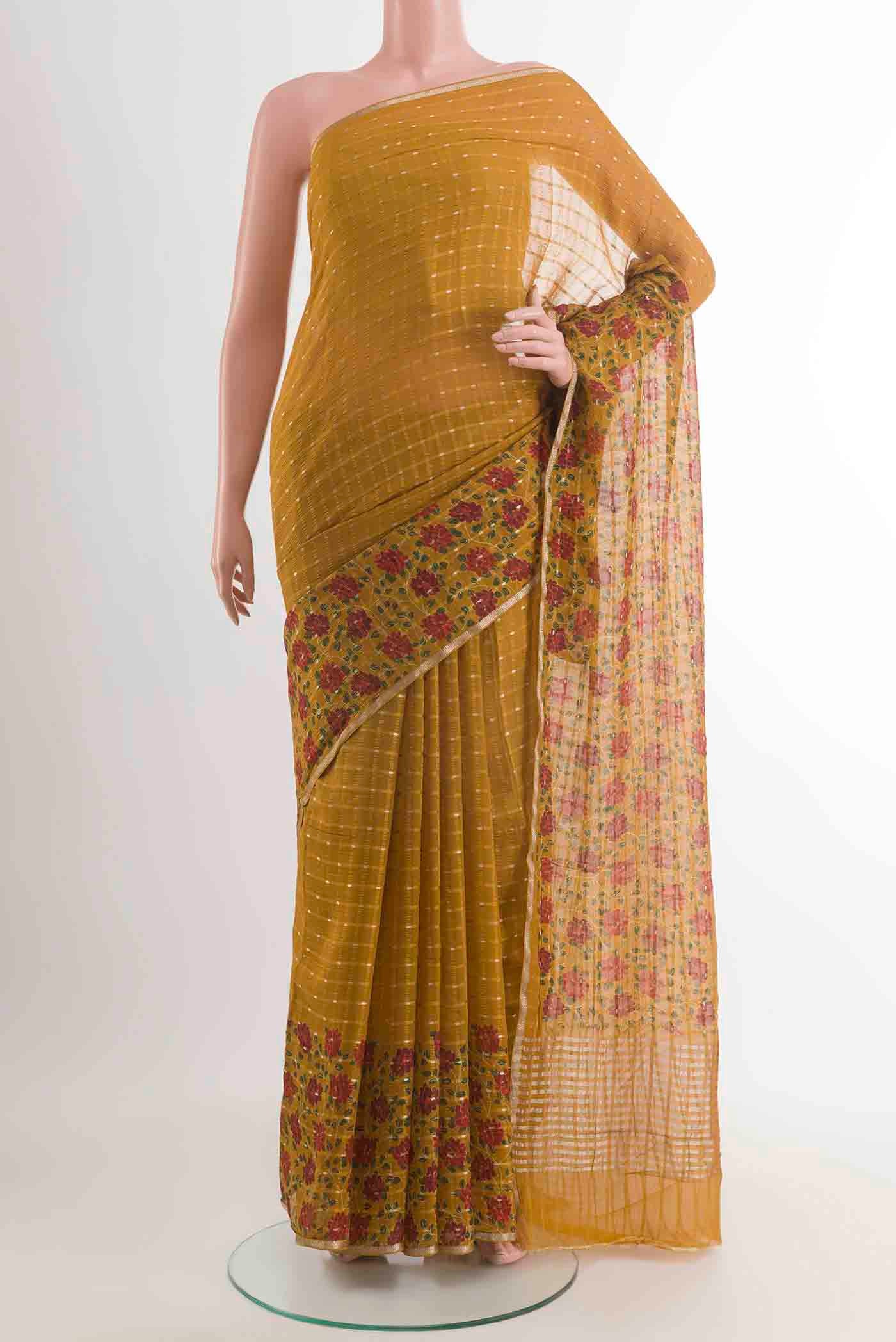Mehandi Green Mysore Chiffon Saree with Checked design on the body and Zari Border displayed on a mannequin