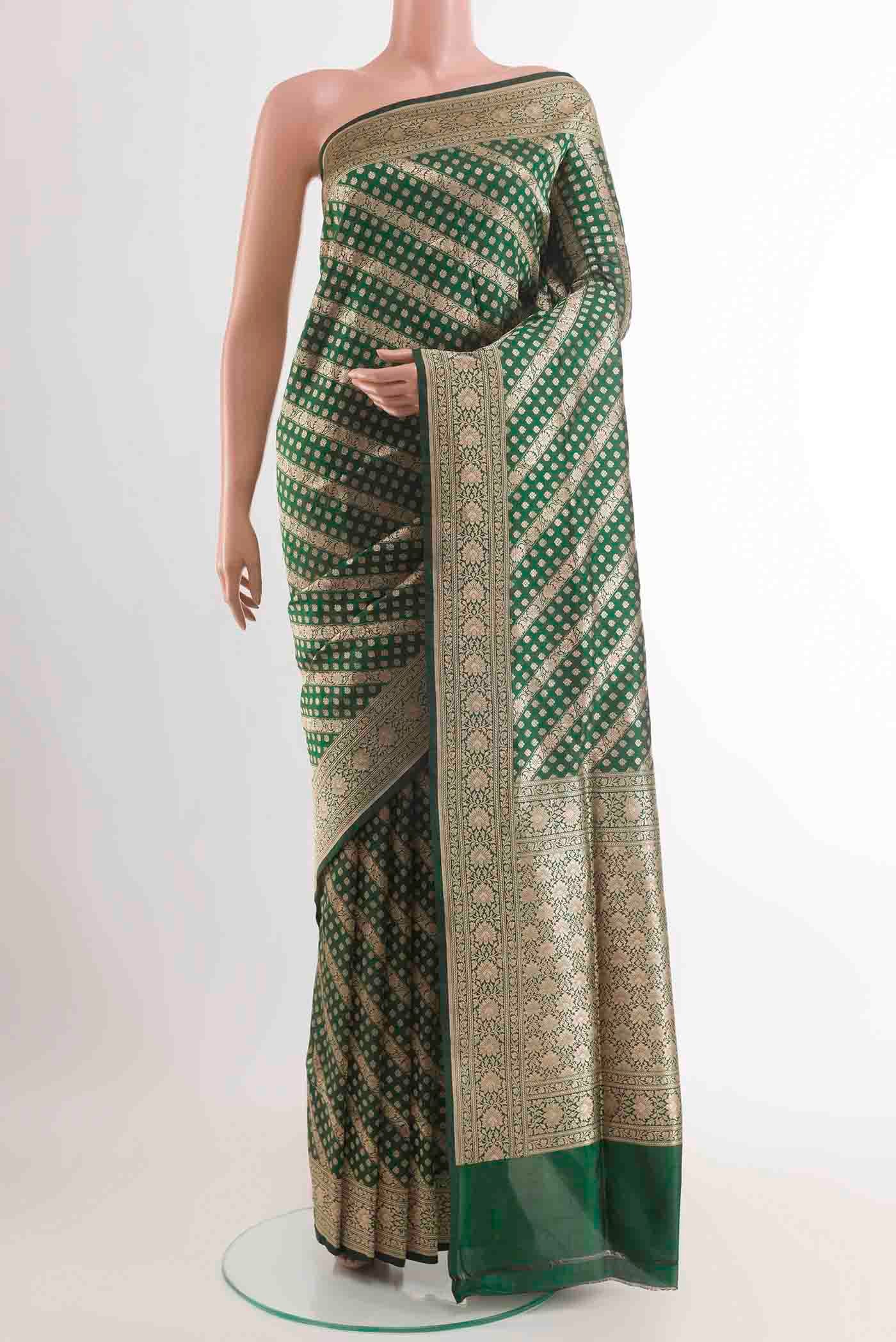 Green Banarasi Silk Saree with Zari Brocade on the body and Zari Border displayed on a mannequin