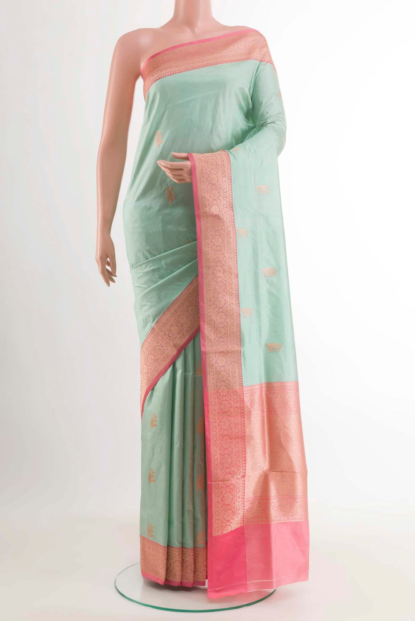 Light Blue Banarasi Katan Silk Saree with Zari Butta on the body and Zari Border displayed on a mannequin