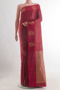 Maroon Kanchipuram Silk Saree with Zari Butta on the body and Zari Border.  displayed on a mannequin