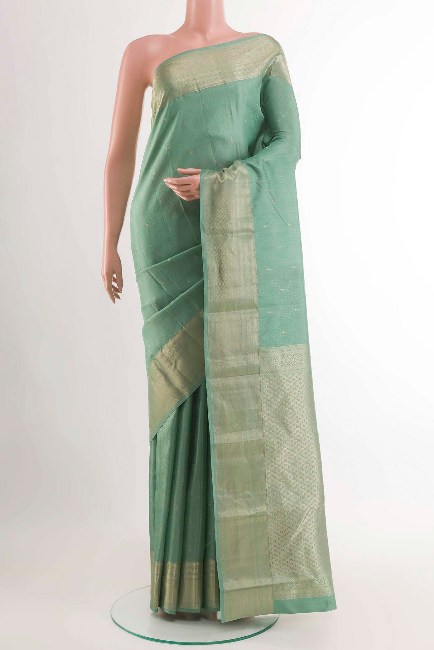 Sage Green Kanchipuram Silk Saree with Jacquard With Zari Butta on the body and Zari Border displayed on a mannequin