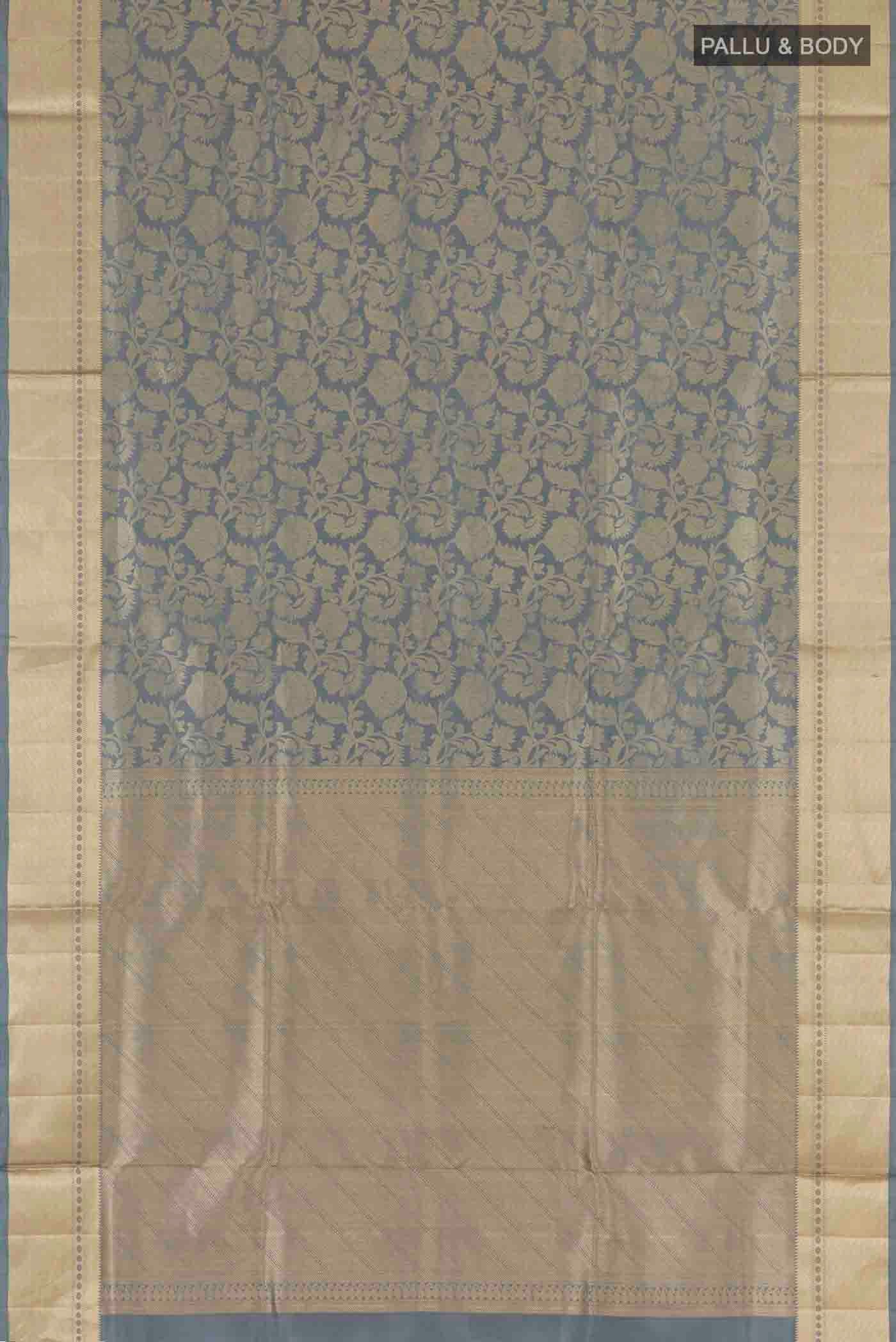 Flat view of Grey Soft Silk Saree with Zari Brocade on the body and Zari Border