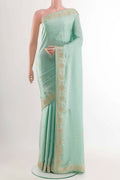 Blue Satin Crepe Saree with Embroidery on the body and Embroidery Border displayed on a mannequin